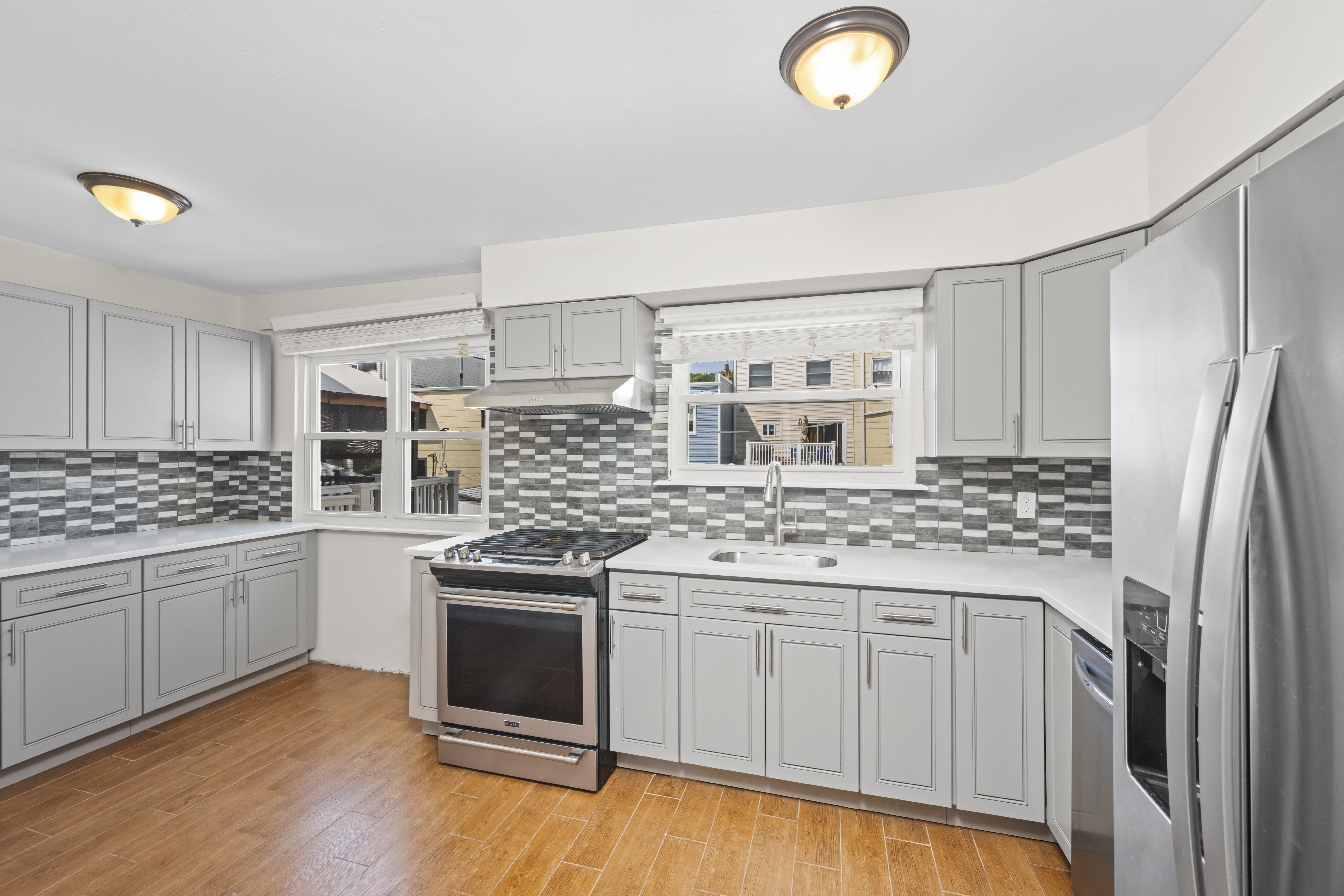 12 Yucca Drive Staten Island, NY 10312 - Photo 9 of 21 a kitchen with stainless steel appliances granite countertop a stove and a sink