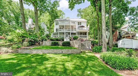 a view of a house with a yard and plants