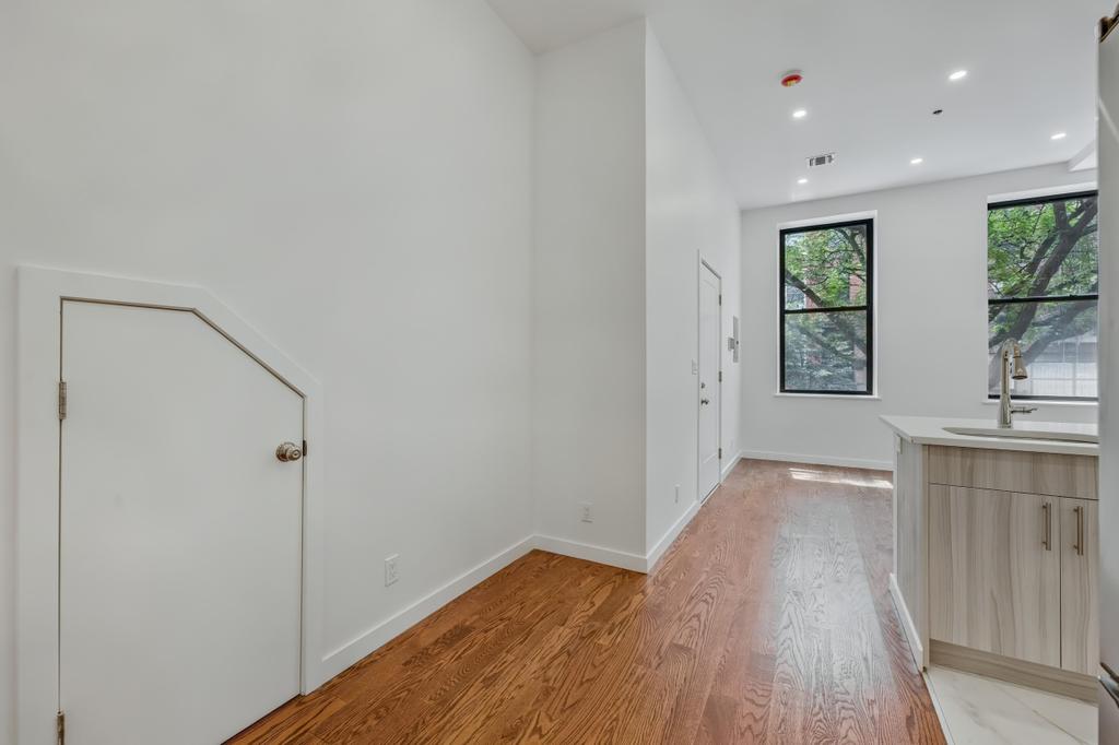 109 President Street, Unit 2 Brooklyn, NY 11231 - Photo 8 of 20 a view of hallway with window and wooden floor
