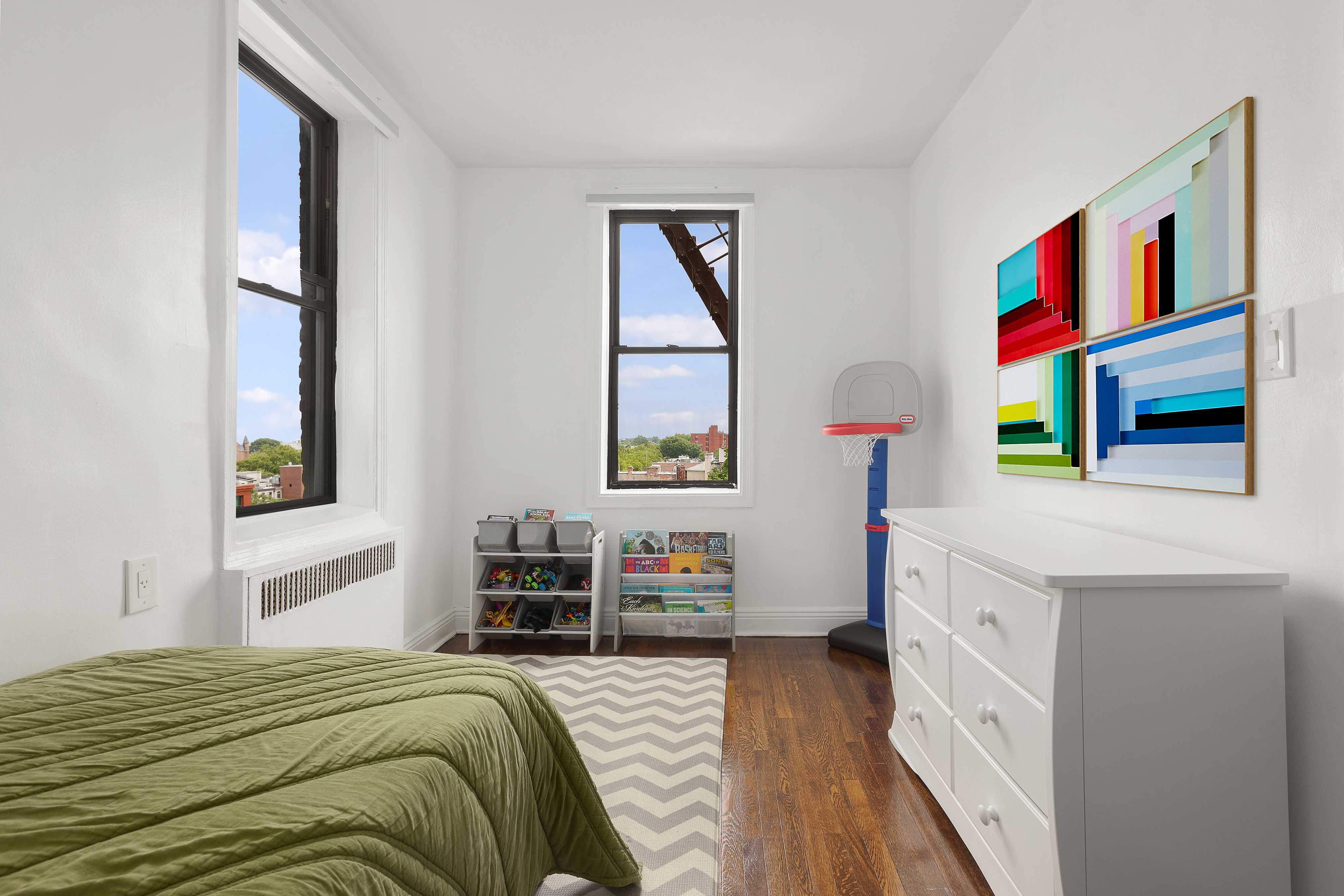 960 Sterling Place, Unit 6J Brooklyn, NY 11213 - Photo 8 of 11 a bedroom with a bed and a cabinets