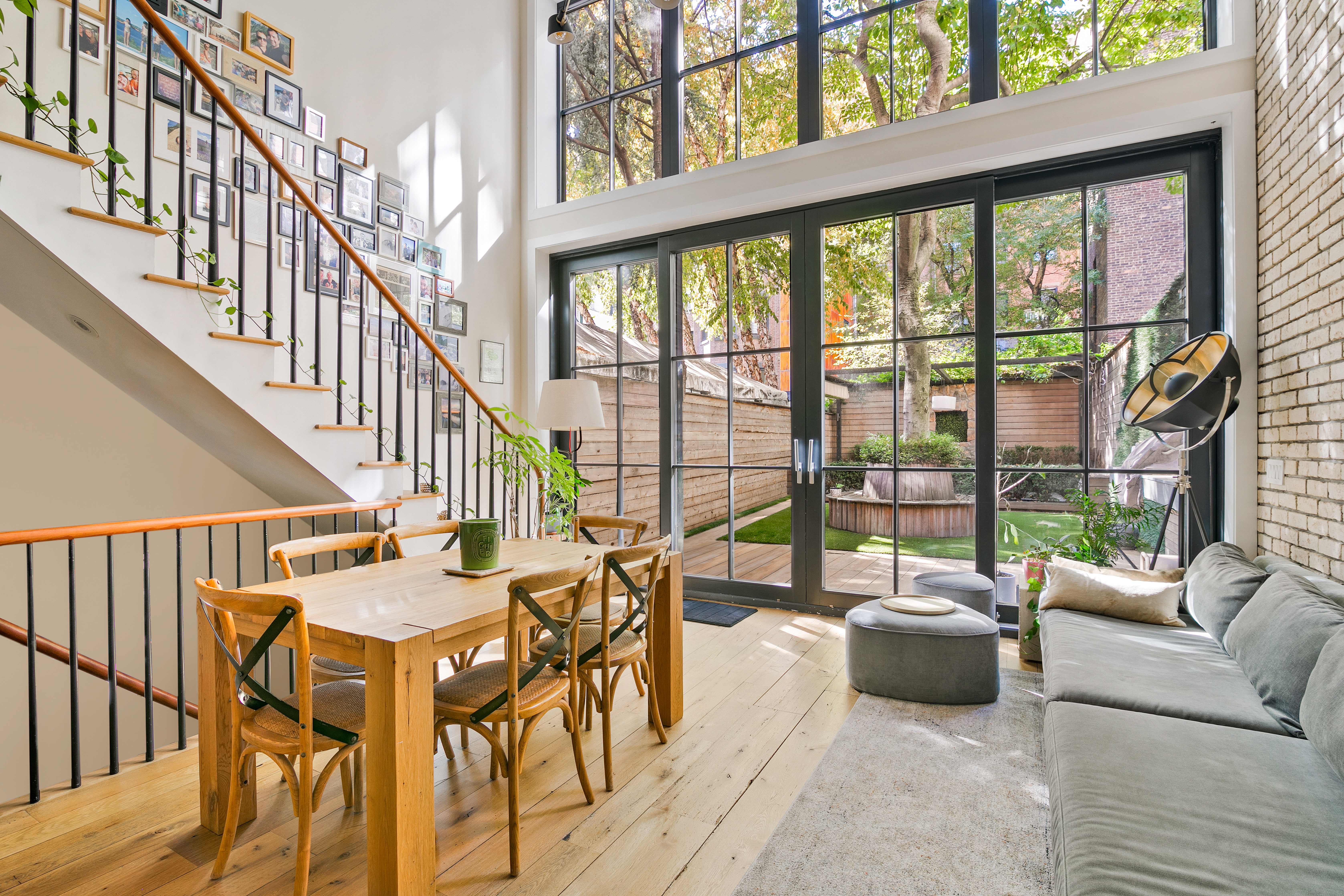 152 West 13th Street Manhattan, NY 10011 - Photo 1 of 28 a living room with furniture and a large window