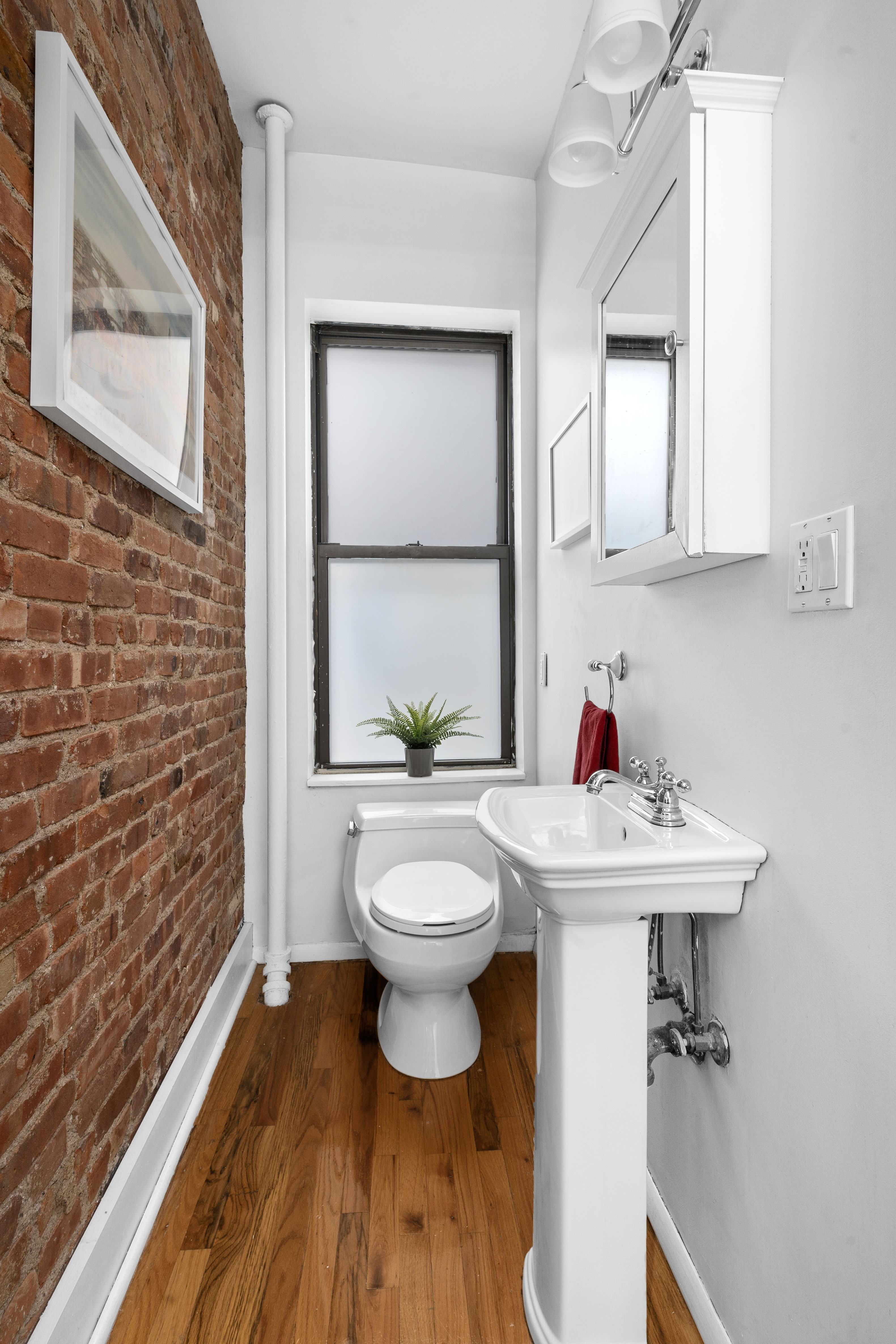 456 15th Street, Unit 1R Brooklyn, NY 11215 - Photo 6 of 14 a bathroom with a sink toilet and shower