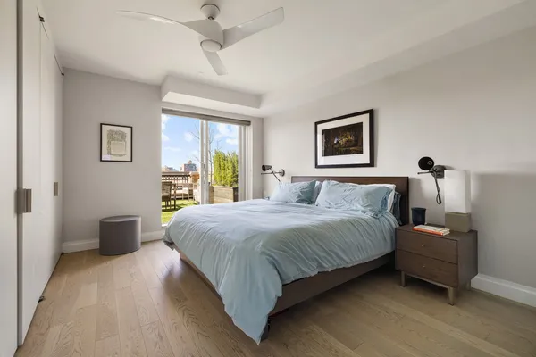 a bedroom with a large bed and a window