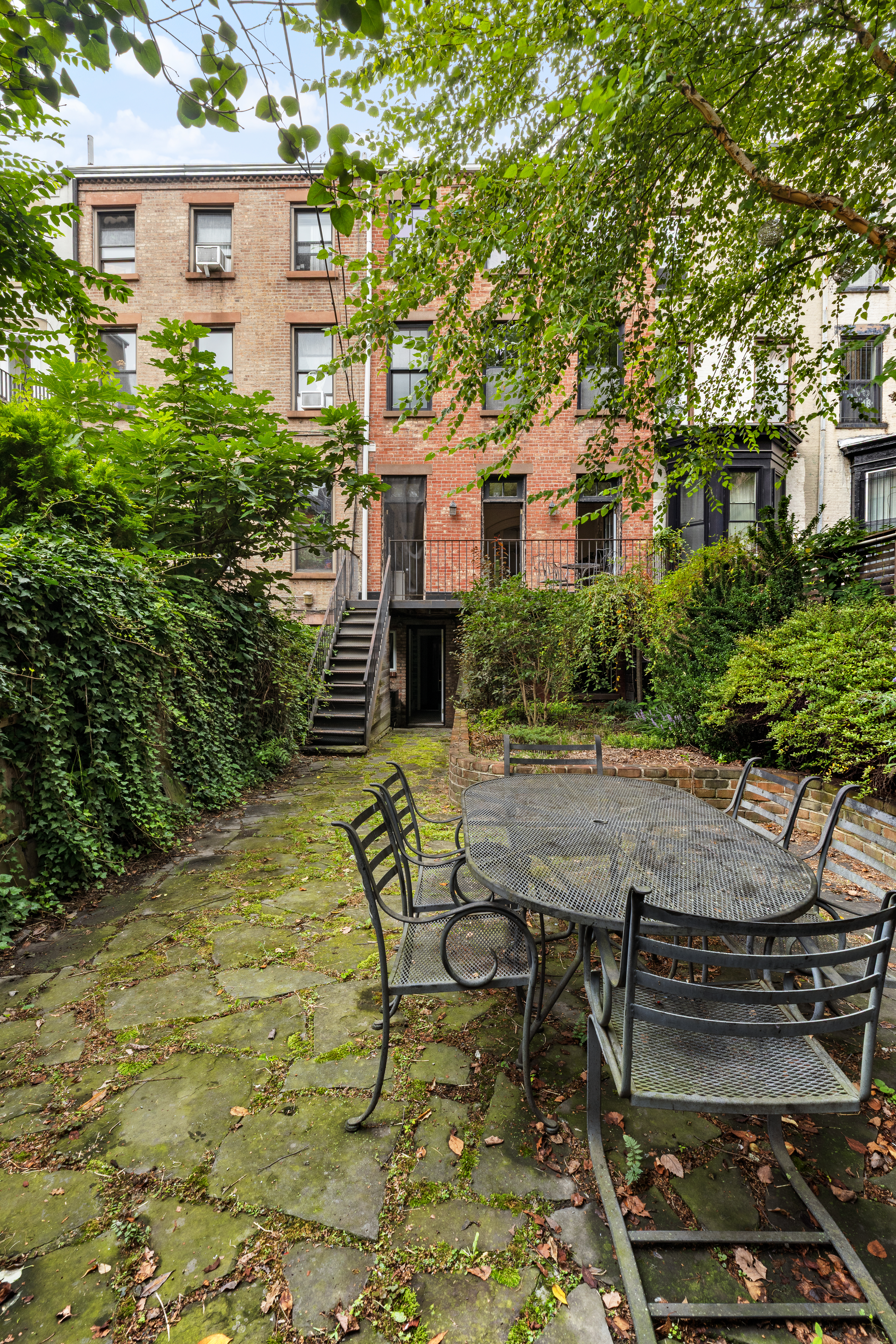 152 Dekalb Avenue Brooklyn, NY 11217 - Photo 23 of 27 a view of backyard with outdoor seating and plants