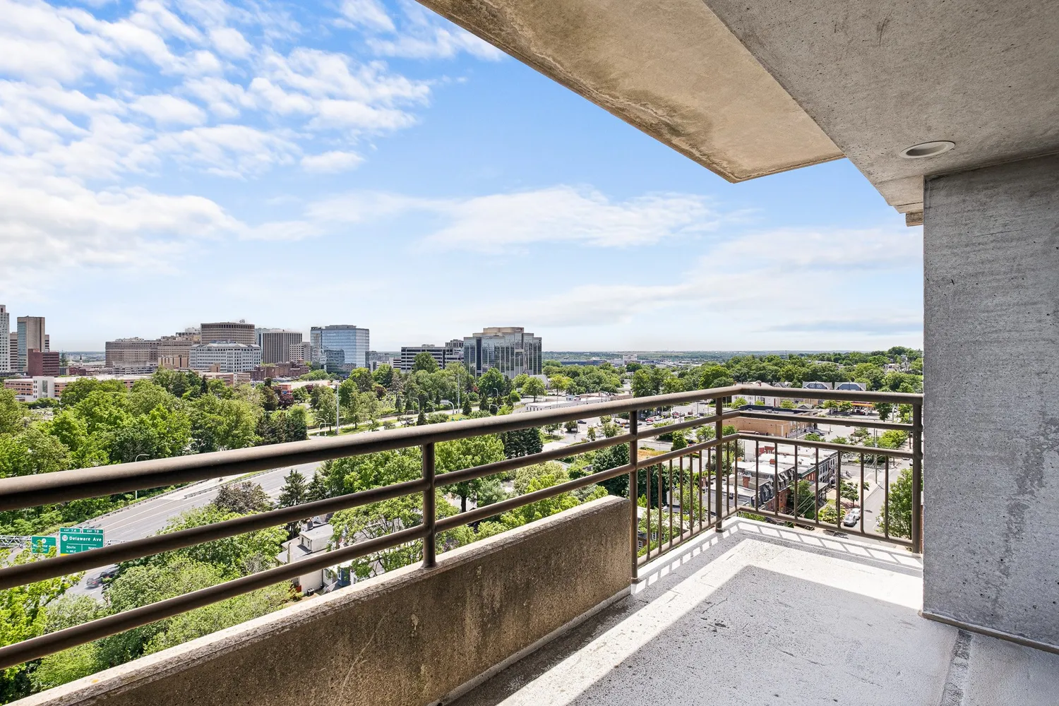 a very nice looking living room with a large window and dining table