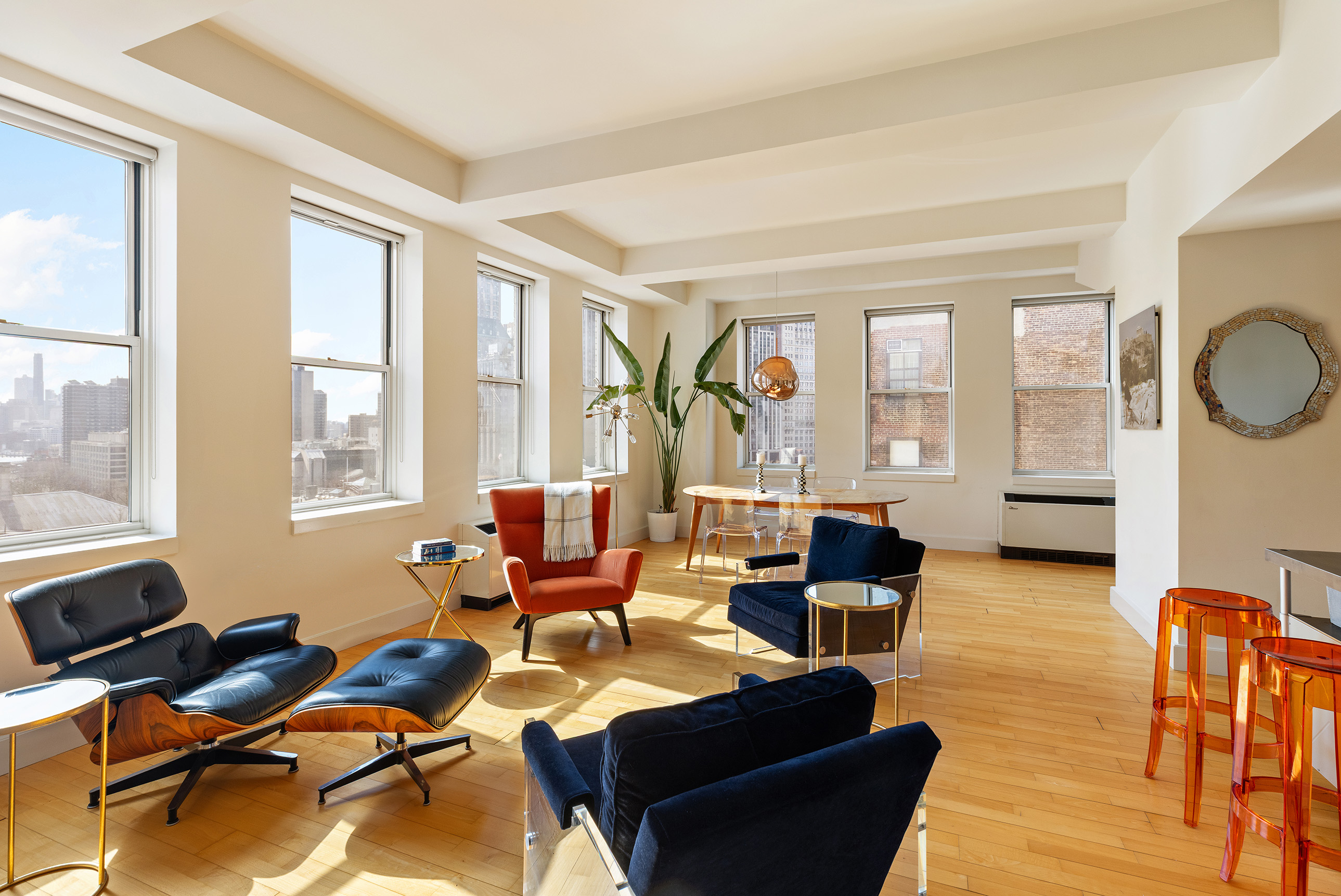 a living room with furniture and large windows