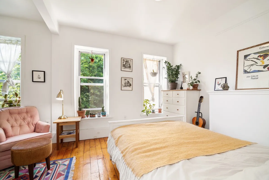 464 Macon Street, Unit 2 Brooklyn, NY 11233 - Photo 4 of 9 a bedroom with a bed and a couch