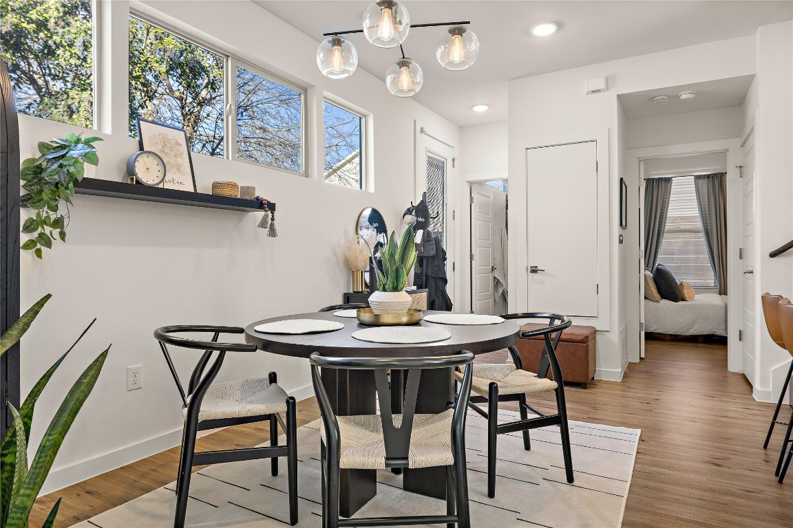 1402 Singleton Avenue, Unit B Austin, TX 78702 - Photo 8 of 26 a view of a dining room with furniture and wooden floor