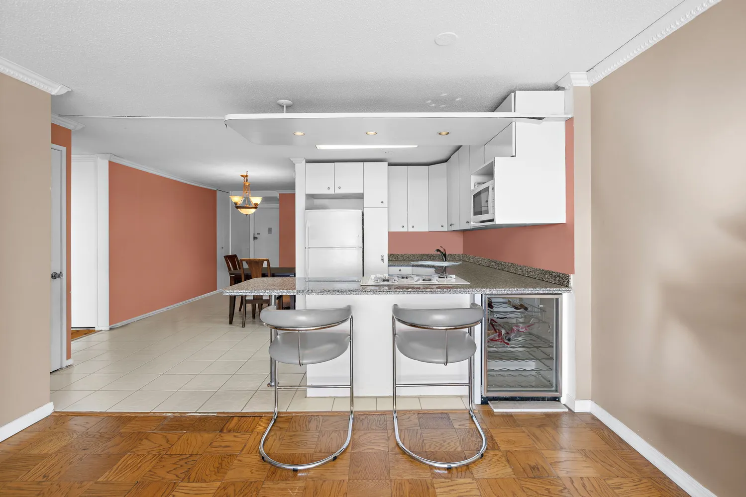 a kitchen with stainless steel appliances kitchen island granite countertop a sink and cabinets
