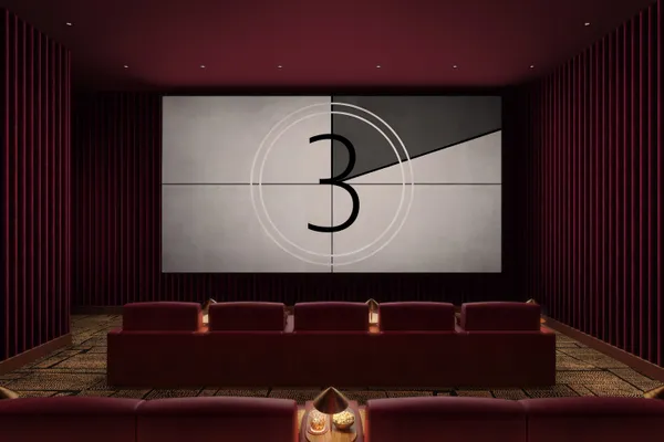 a living room with furniture and a lamp