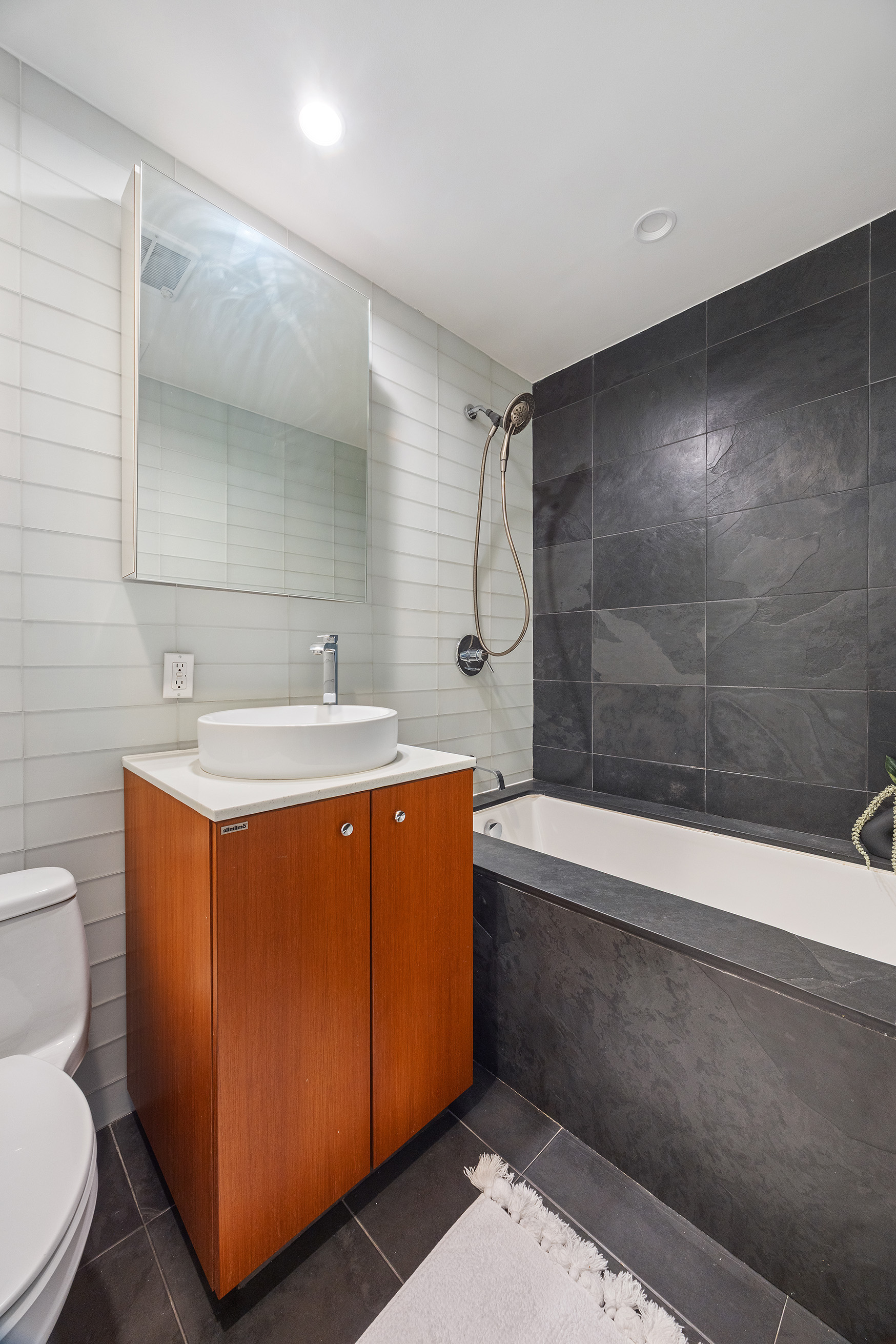 425 East 13th Street, Unit PHFG Manhattan, NY 10009 - Photo 22 of 31 a bathroom with a sink toilet and shower