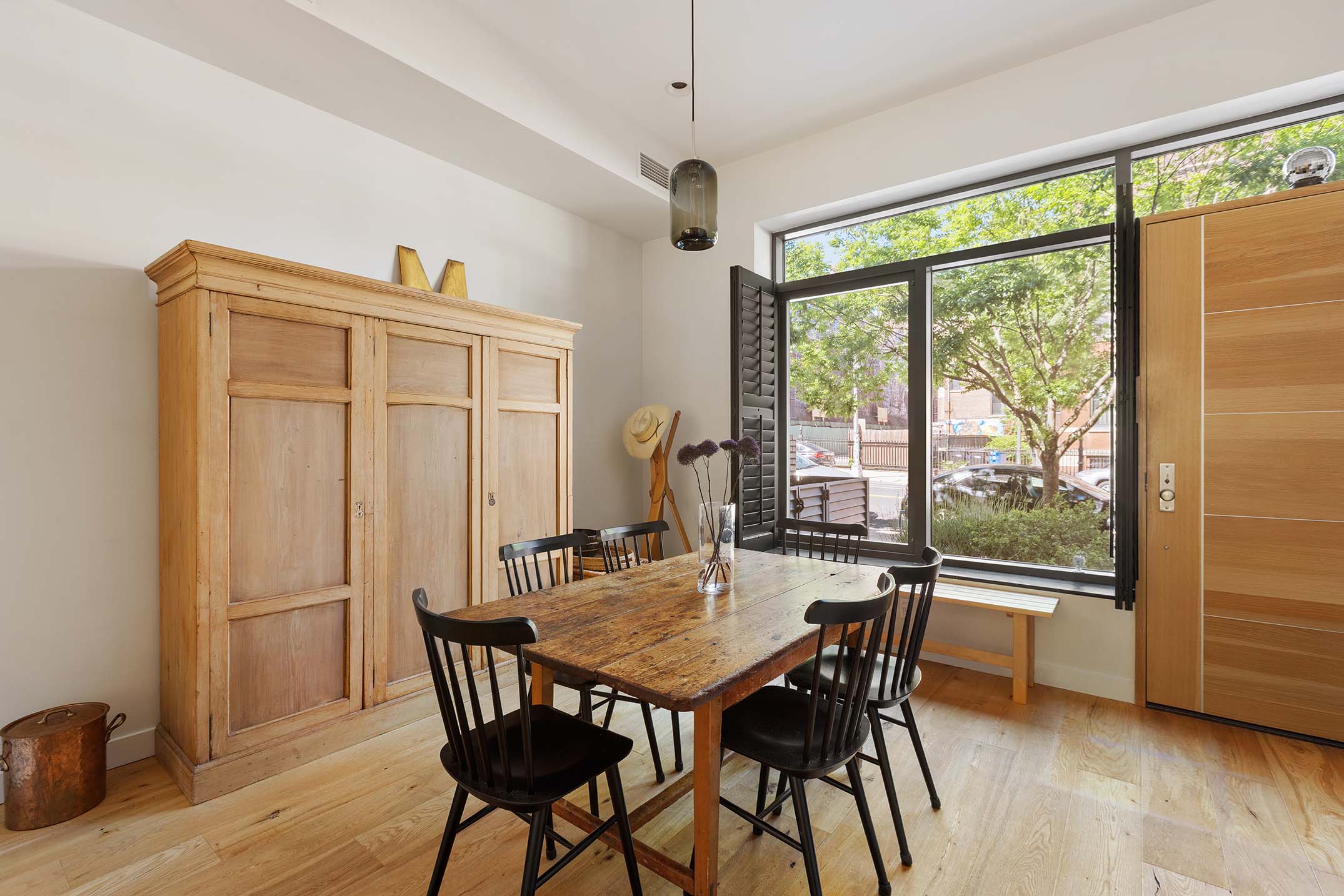 27 Clermont Avenue Brooklyn, NY 11205 - Photo 8 of 19 a view of a dining room with furniture window and wooden floor