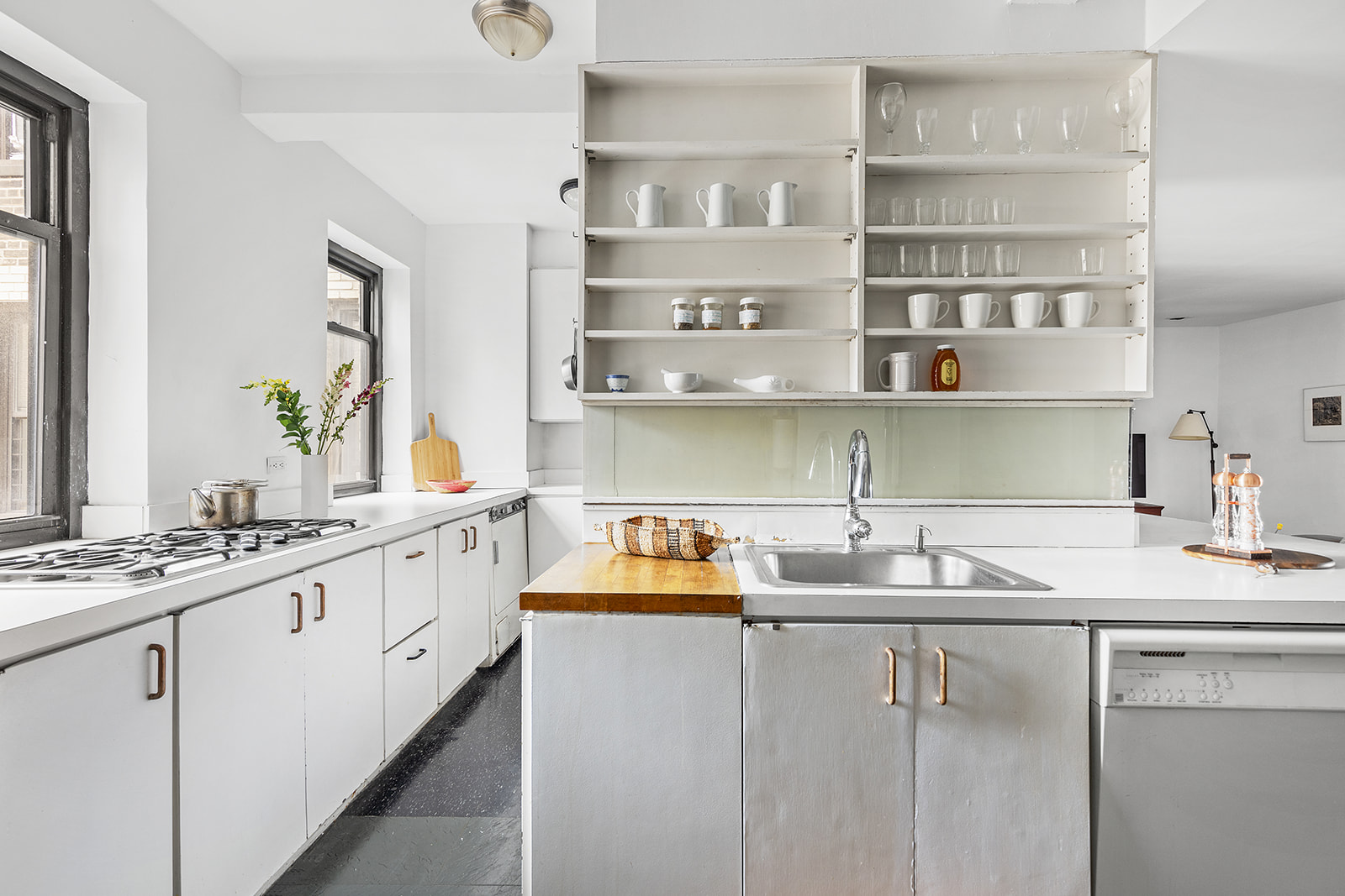 110-118 Riverside Drive, Unit 15A Manhattan, NY 10024 - Photo 5 of 17 a kitchen with stainless steel appliances white cabinets and a sink