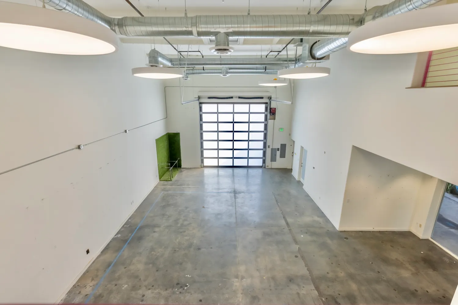 a kitchen that has a sink and a stove in it