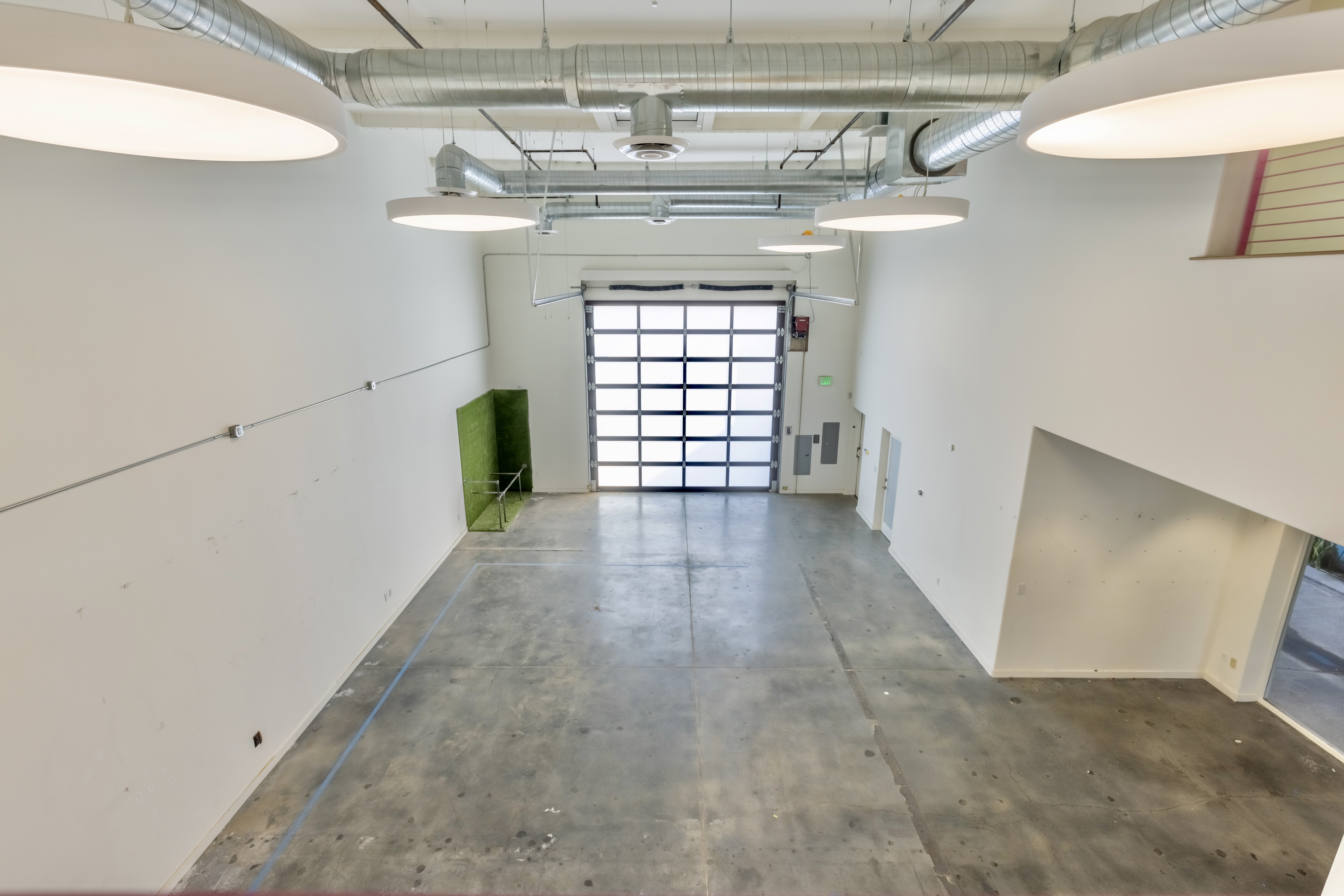 3058 North Lima Street Burbank, CA 91504 - Photo 24 of 41 a view of a hallway with wooden floor and a chandelier