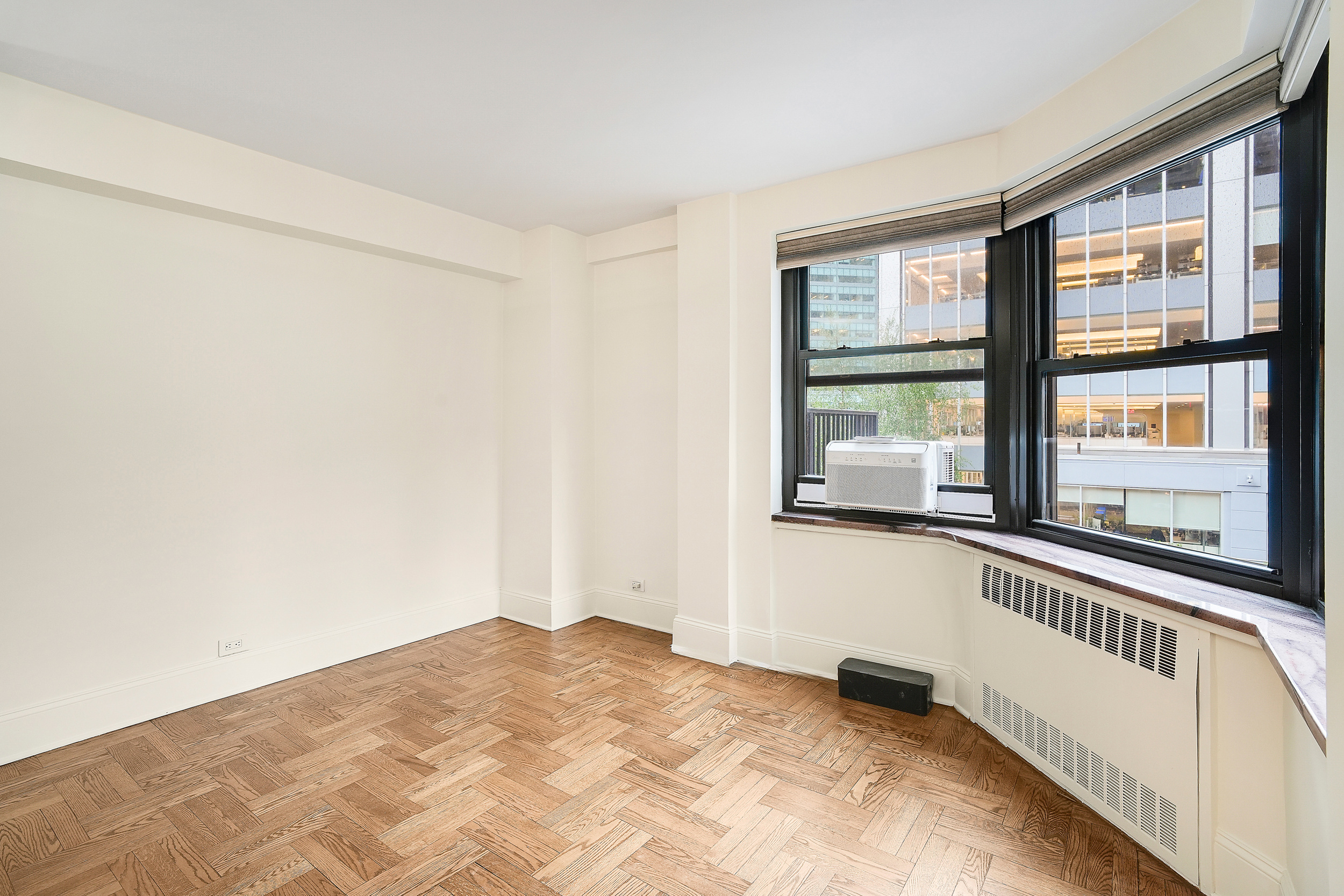 135 East 54th Street, Unit 12M Manhattan, NY 10022 - Photo 6 of 10 a view of an empty room with a window