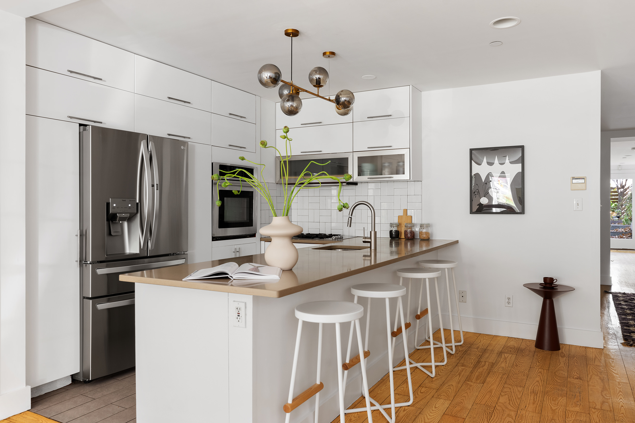 321 Union Street, Unit 1B Brooklyn, NY 11231 - Photo 5 of 10 a kitchen with stainless steel appliances granite countertop a sink and a refrigerator