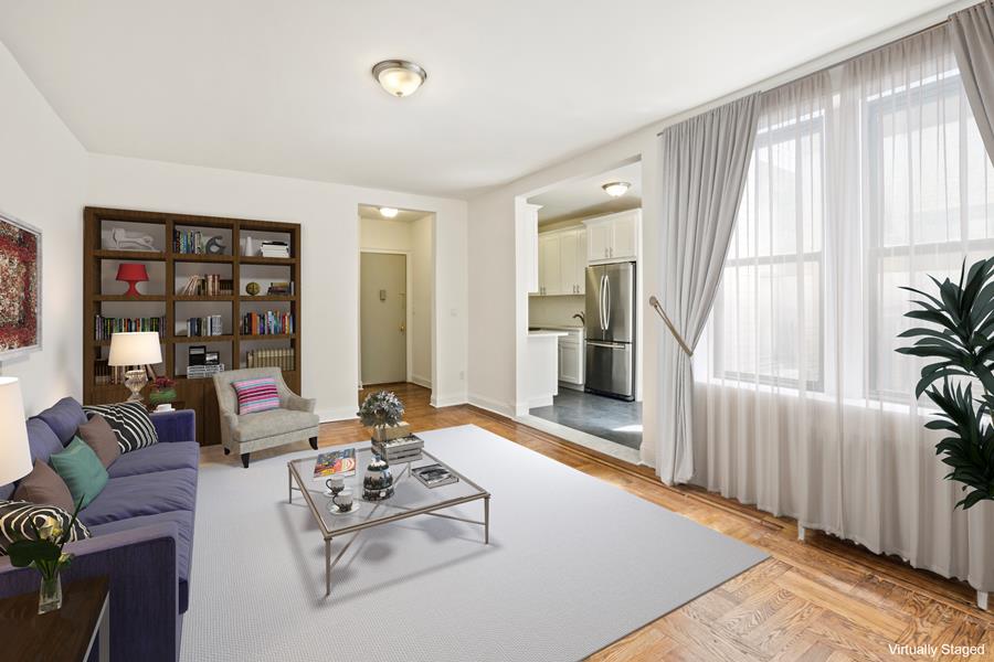 a living room with furniture and large window