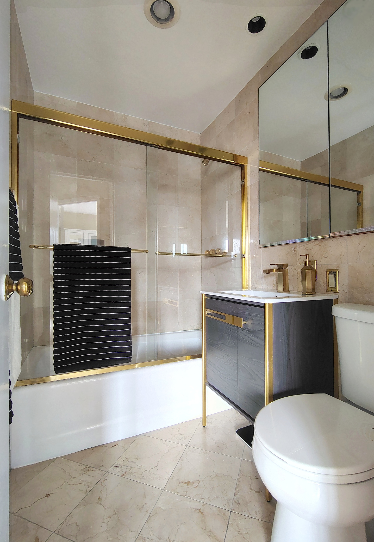 201 West 70th Street, Unit 17A Manhattan, NY 10023 - Photo 6 of 20 a bathroom with a bathtub and shower