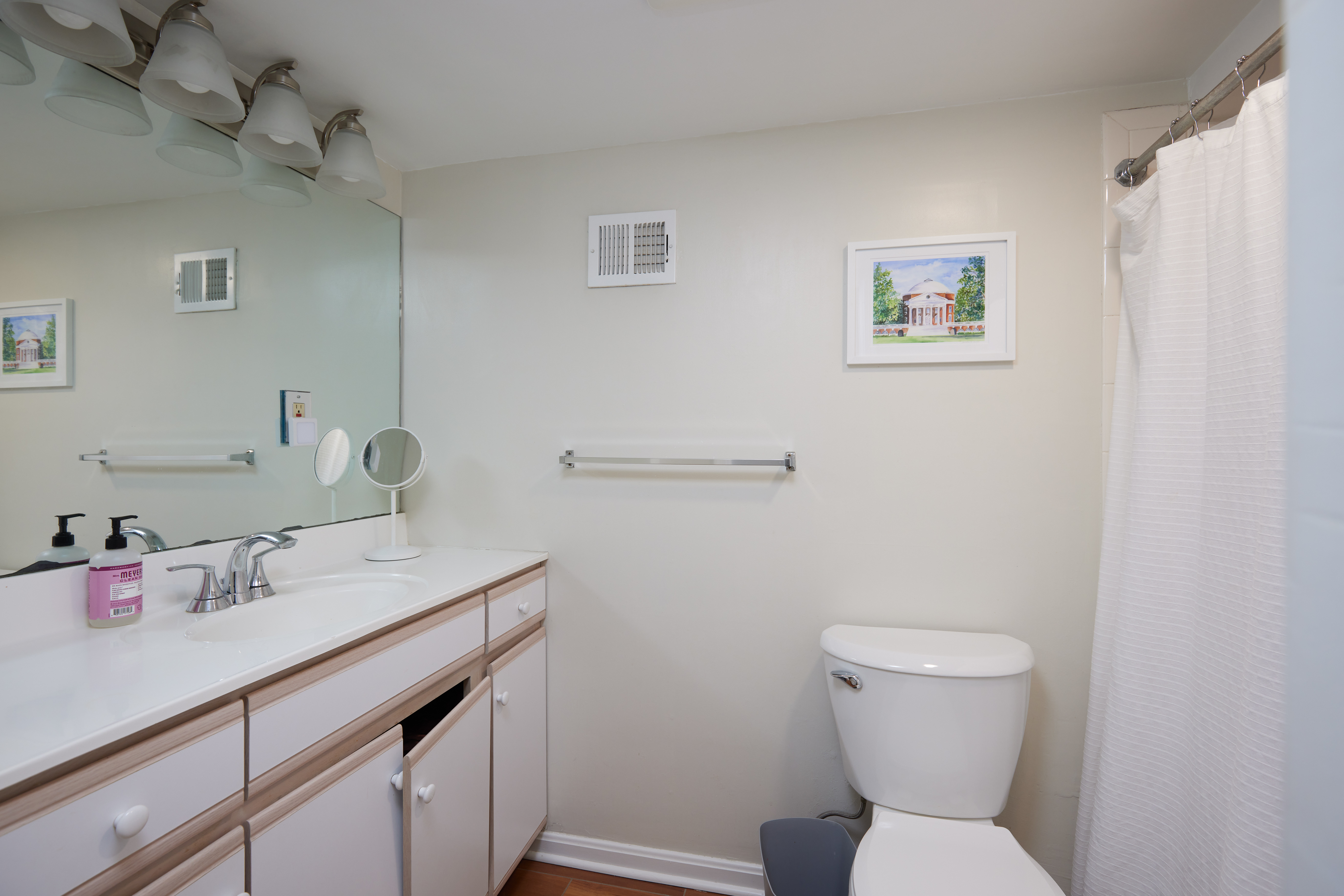 3420 R Street Northwest Washington, DC 20007 - Photo 15 of 53 a bathroom with a toilet sink and mirror