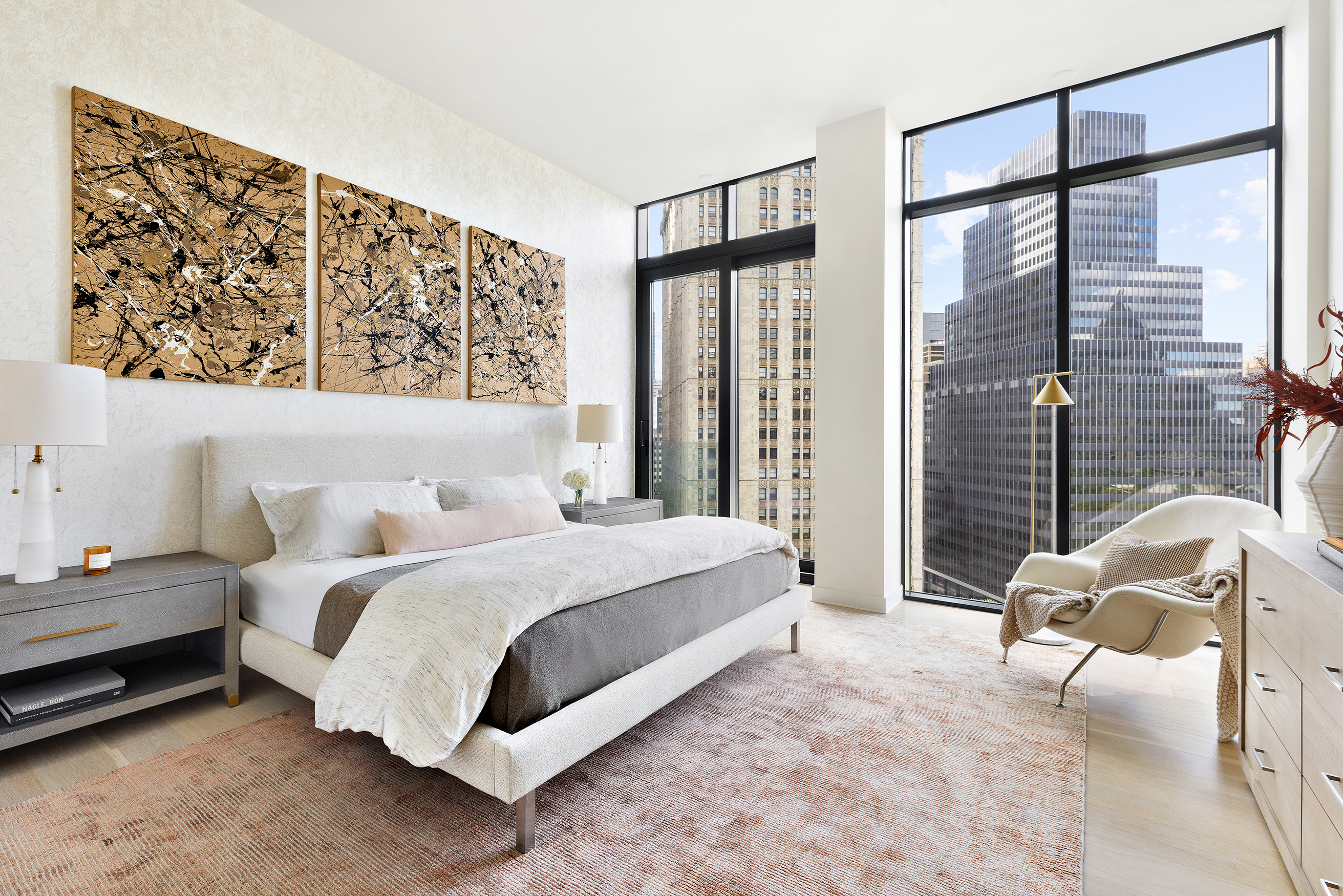 33 Park Row, Unit 14A Manhattan, NY 10038 - Photo 12 of 24 a bedroom with a bed couch and window