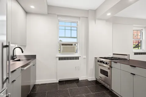 a kitchen with a stove and a sink