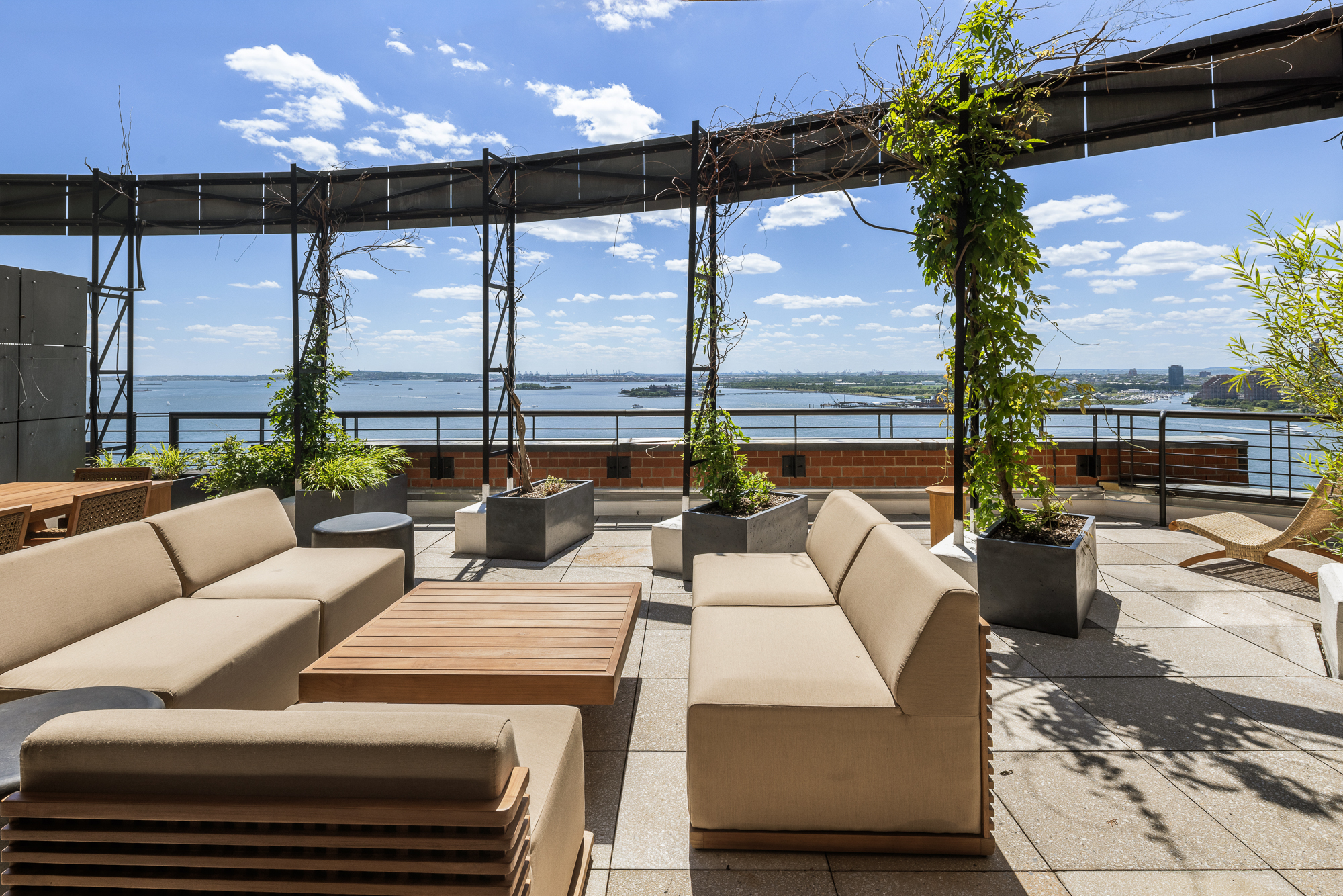 377 Rector Place, Unit PHA Manhattan, NY 10280 - Photo 11 of 48 a view of a patio with couches and potted plants