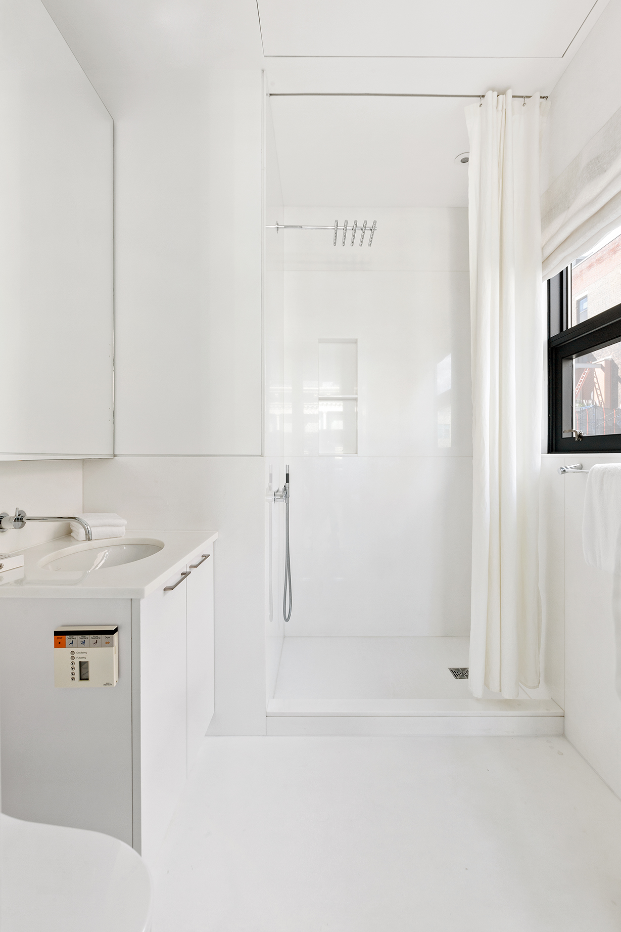 40 Mercer Street, Unit PH30 Manhattan, NY 10013 - Photo 16 of 20 a bathroom with a sink and a mirror
