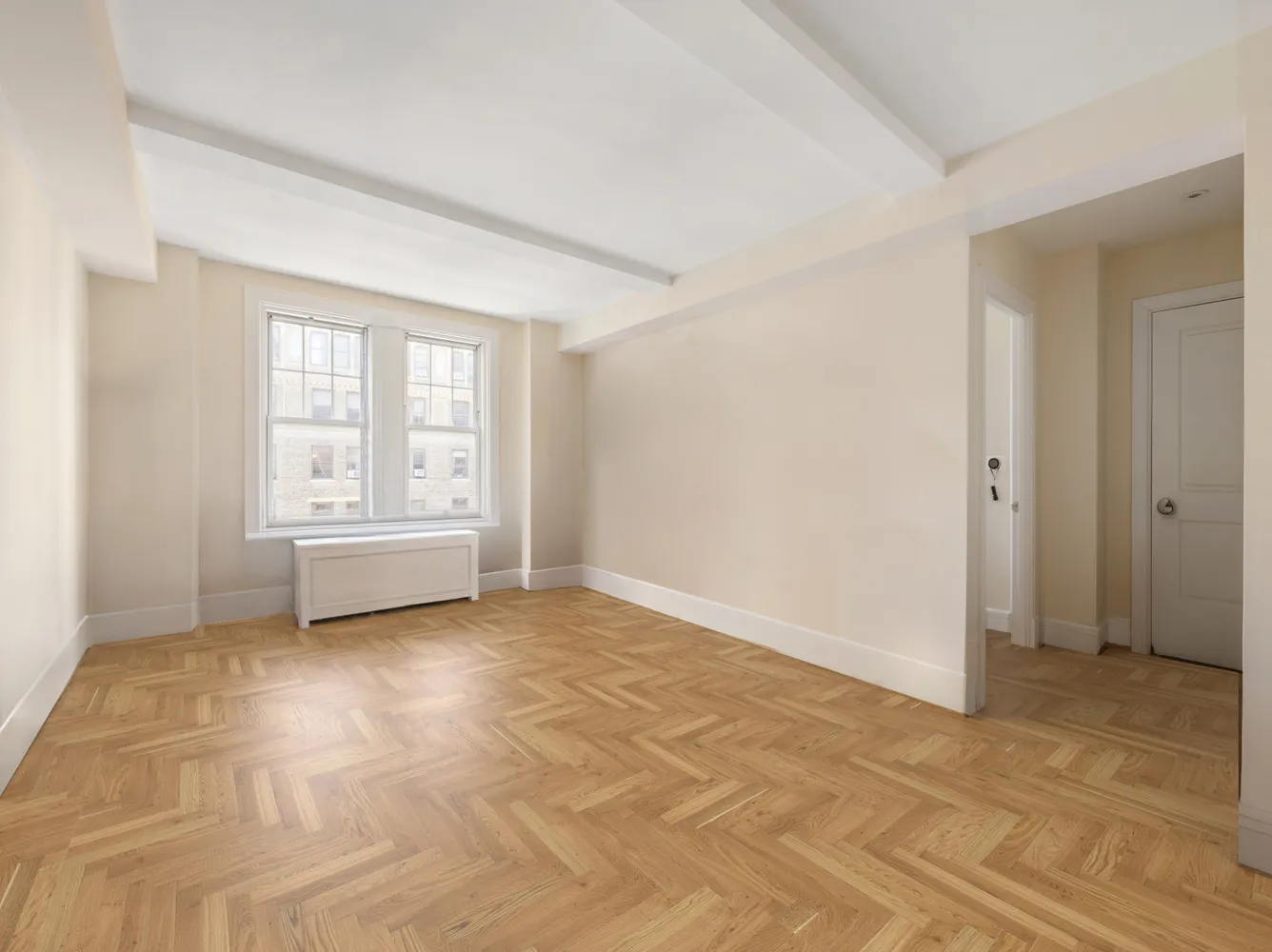 a view of an empty room with a window