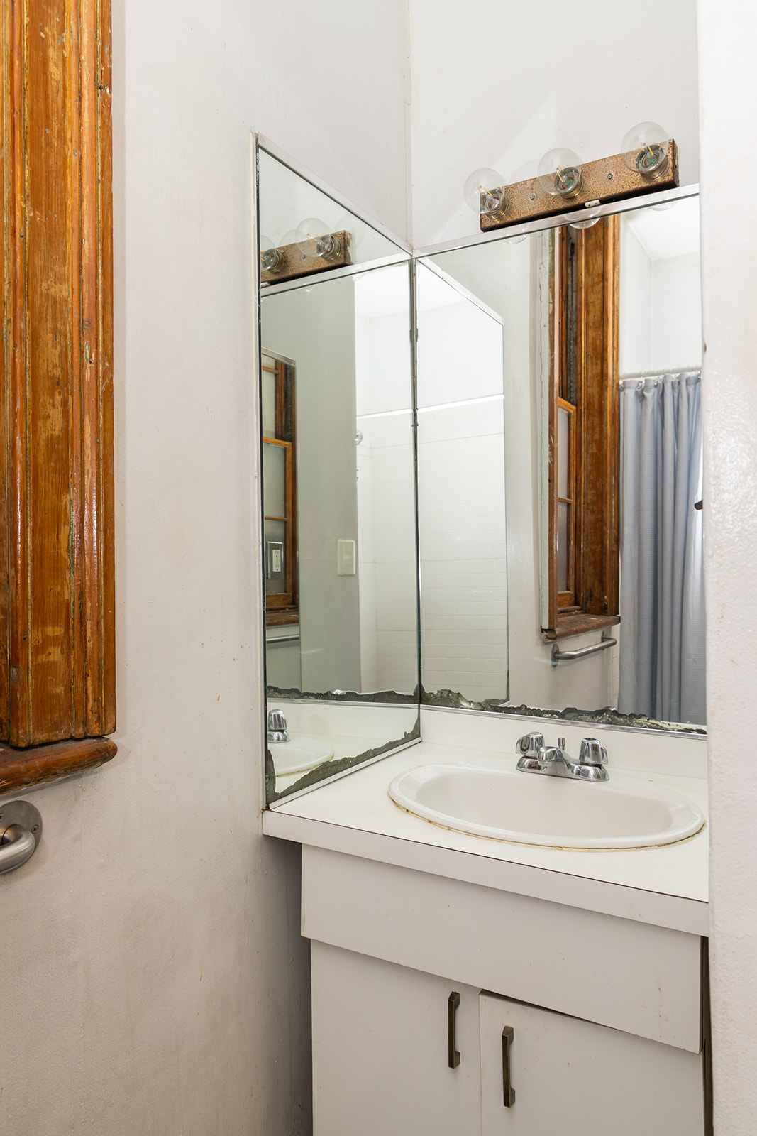 147 Sullivan Street, Unit 2A Manhattan, NY 10012 - Photo 8 of 8 a bathroom with a sink and a mirror