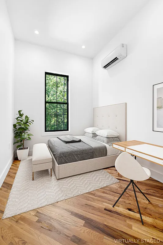 866 Bushwick Avenue, Unit 3 Brooklyn, NY 11221 - Photo 9 of 12 a bedroom with a bed and a couch