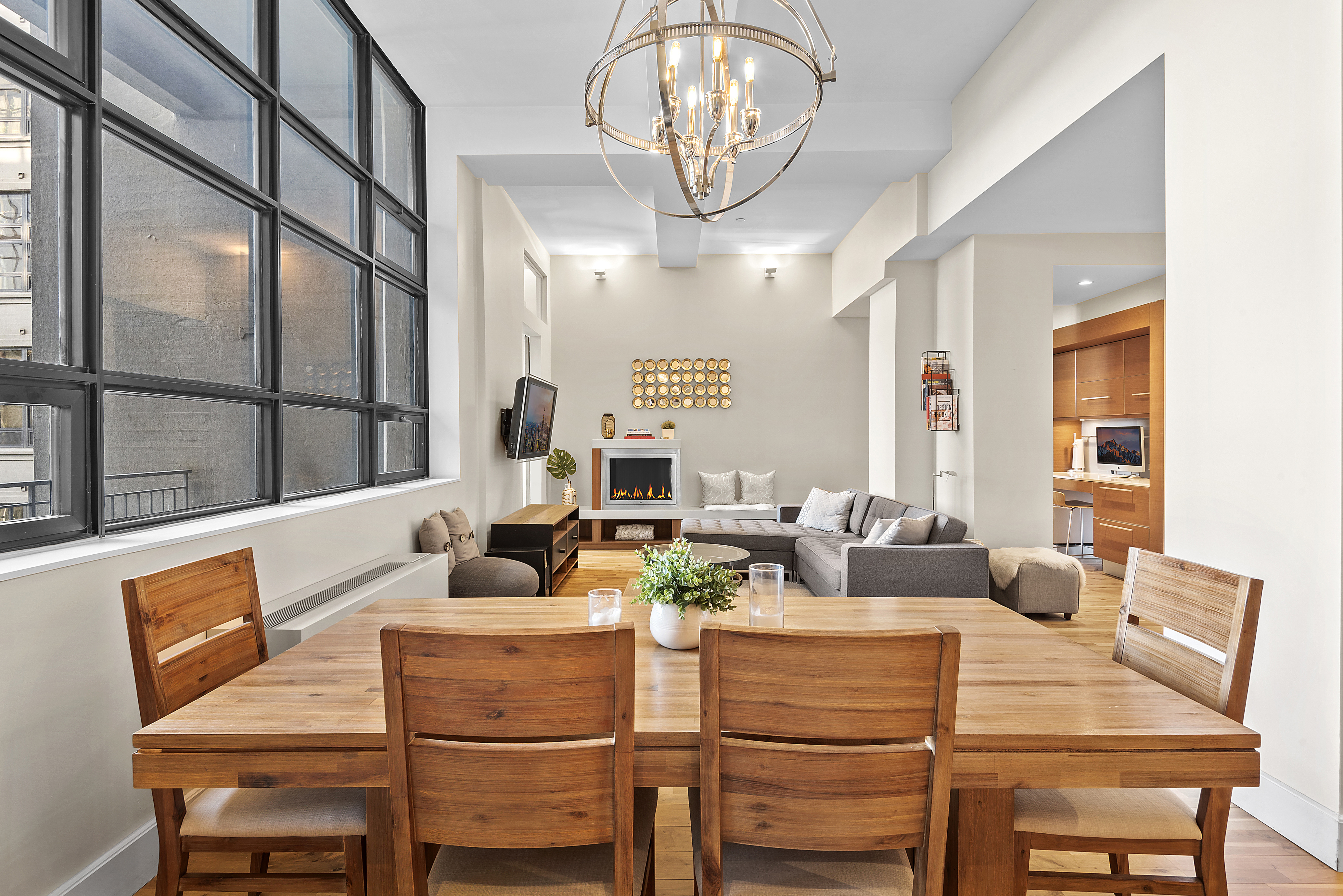 360 Furman Street, Unit 723/724 Brooklyn, NY 11201 - Photo 9 of 63 a dining room with furniture a chandelier and window