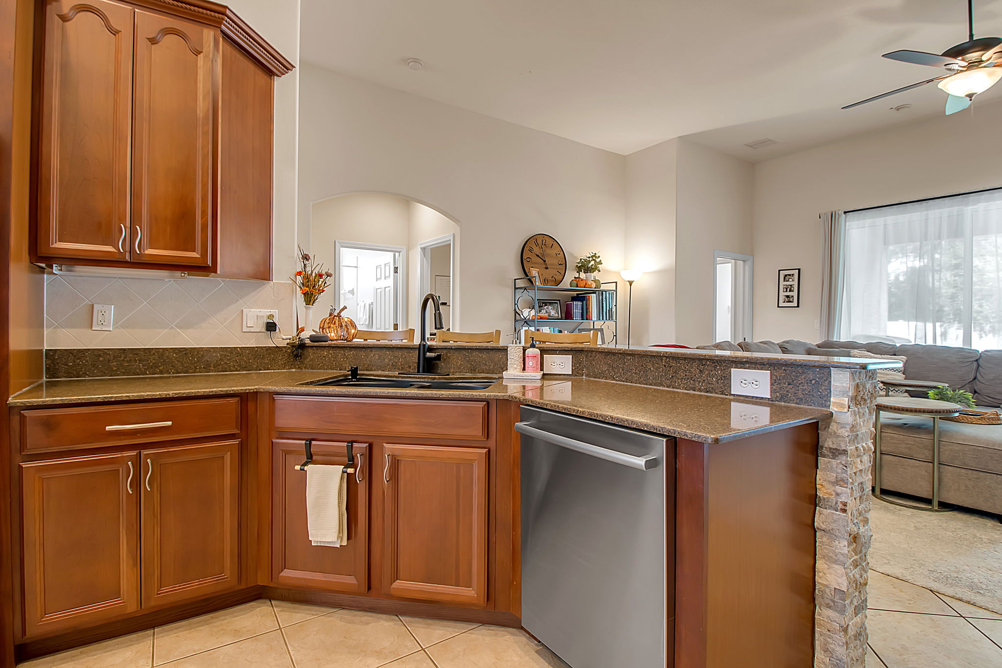 6106 34th Court East Bradenton, FL 34203 - Photo 26 of 69 a kitchen with stainless steel appliances granite countertop a sink and a stove