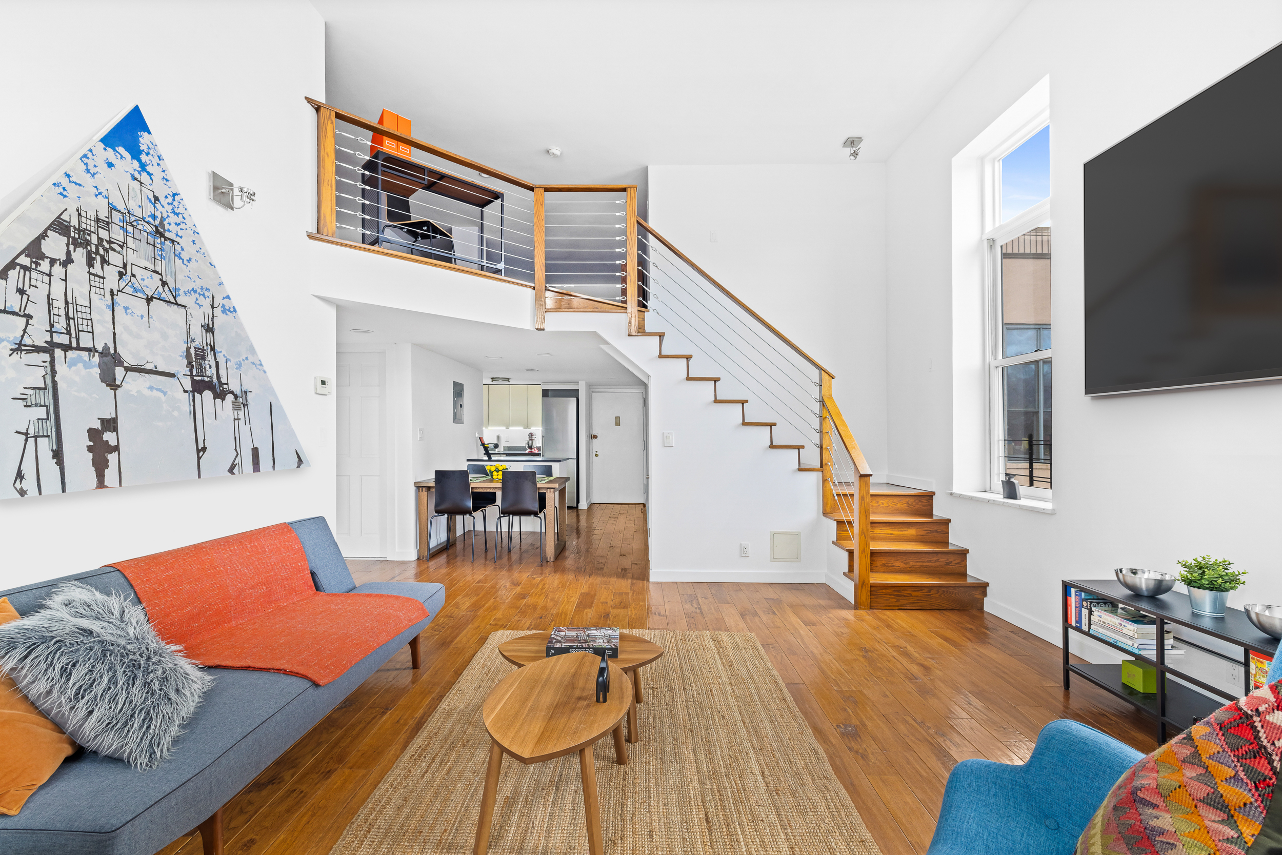 55 Poplar Street, Unit 6K Brooklyn, NY 11201 - Photo 4 of 15 a living room with furniture and a flat screen tv