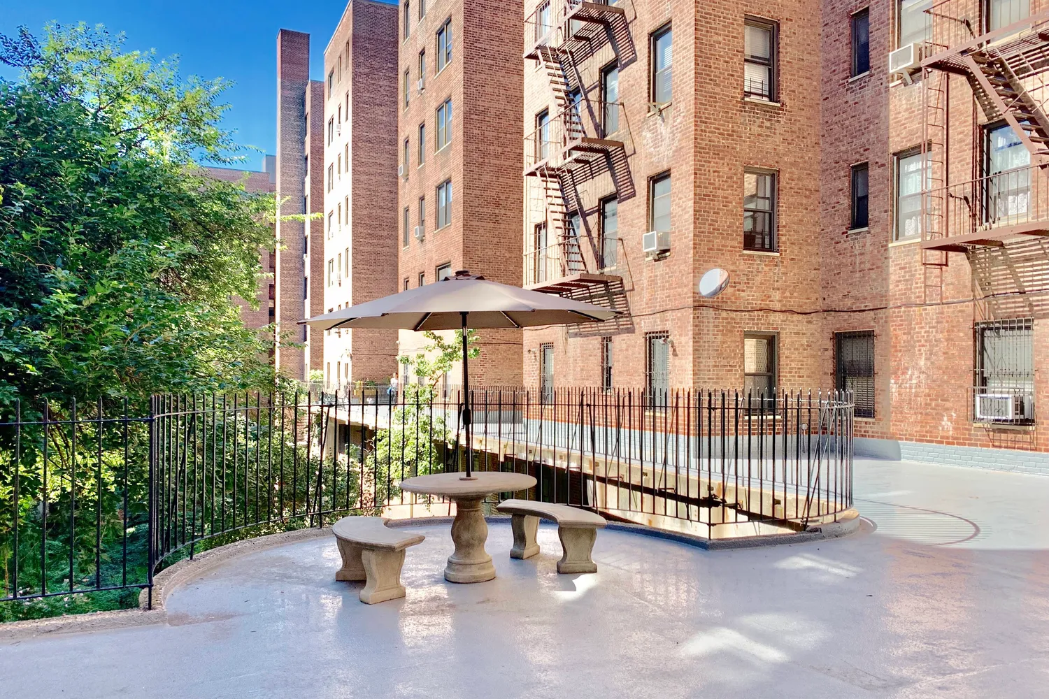 a view of a patio with couches and table and chairs and potted plants