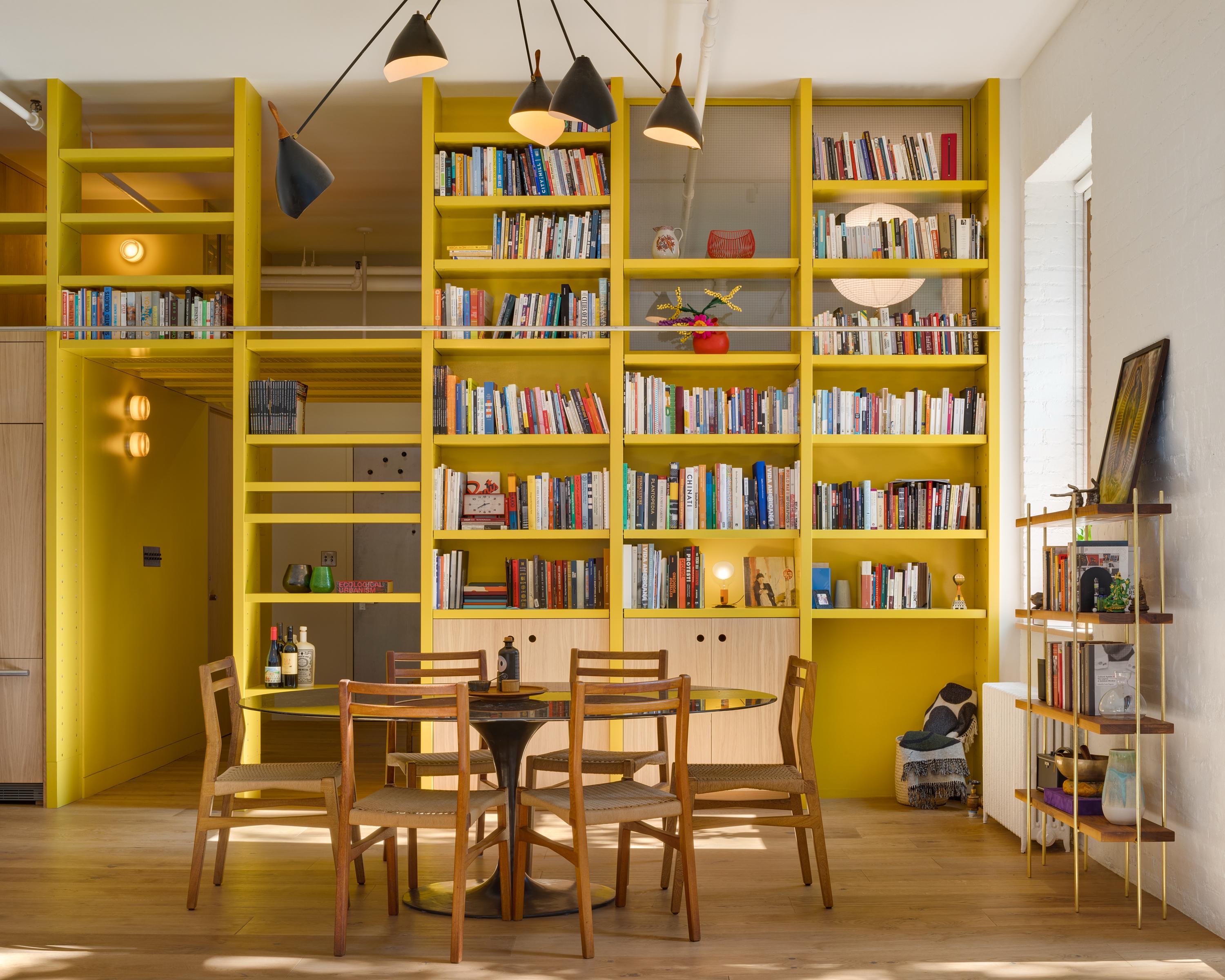 140 Sullivan Street, Unit 1FR Manhattan, NY 10012 - Photo 3 of 19 a view of a dining room with furniture and wooden floor