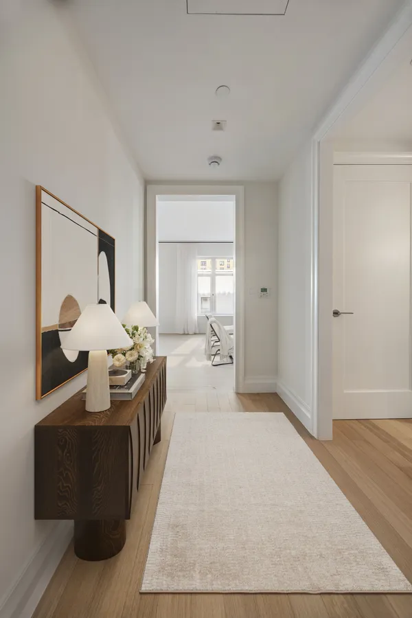 a room with a bed and a mirror