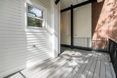 a view of a brick building with many windows