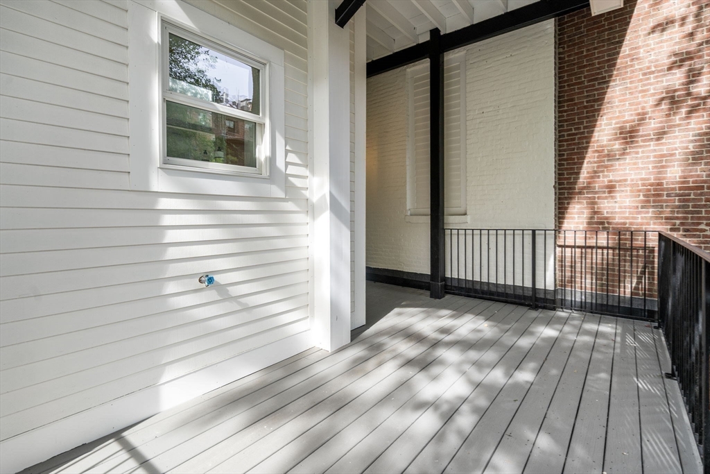 34 Worcester Square, Unit 2 Boston, MA 02118 - Photo 15 of 18 a view of a balcony with wooden floor