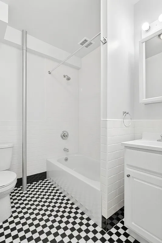1100 Dean Street, Unit 3 Brooklyn, NY 11216 - Photo 4 of 5 a bathroom with a bathtub sink and toilet