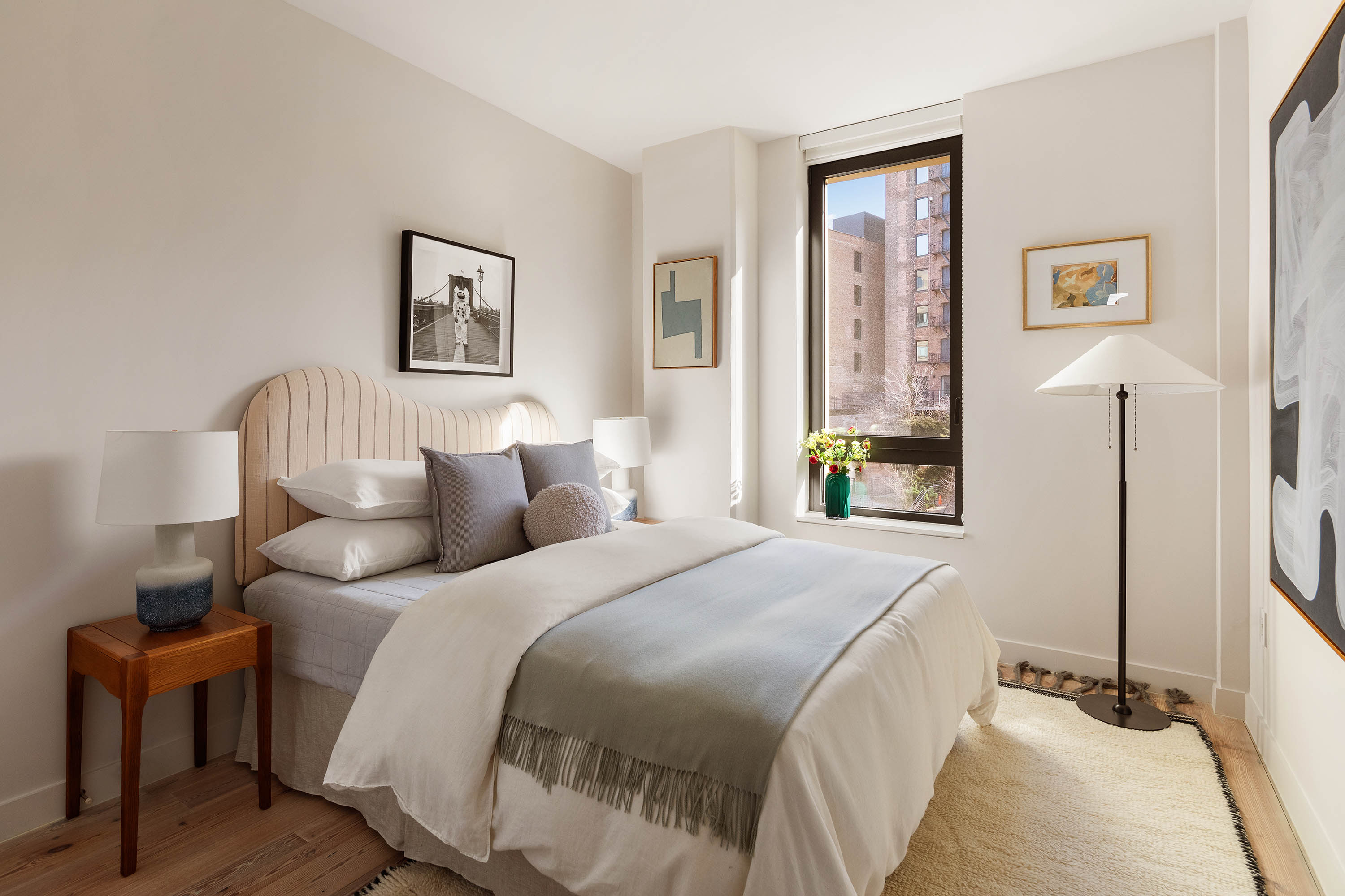 90 Furman Street, Unit N411 Brooklyn, NY 11201 - Photo 15 of 29 a bedroom with a bed and a cabinets