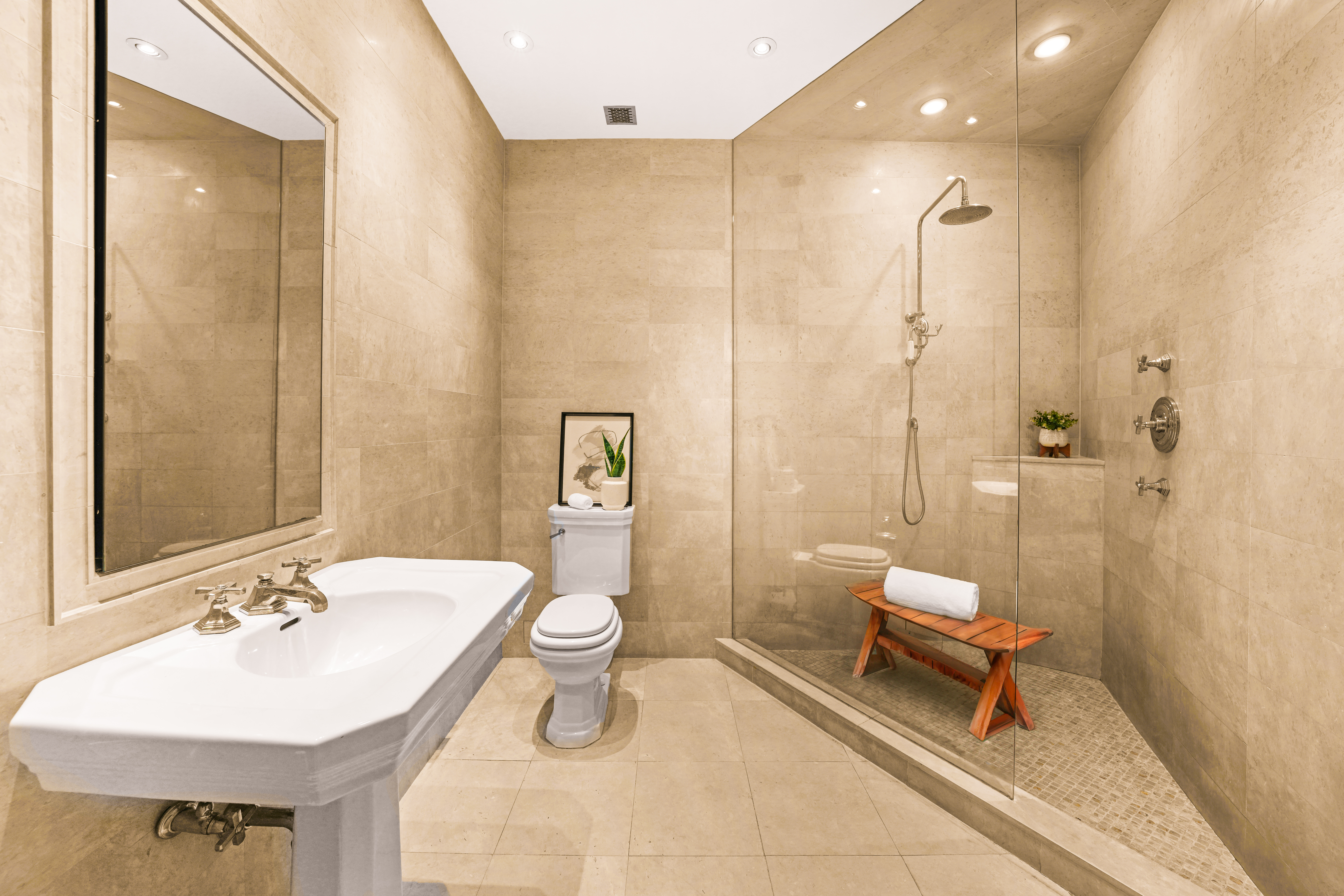 247 East 71st Street Manhattan, NY 10021 - Photo 26 of 31 a bathroom with a sink a toilet and a mirror