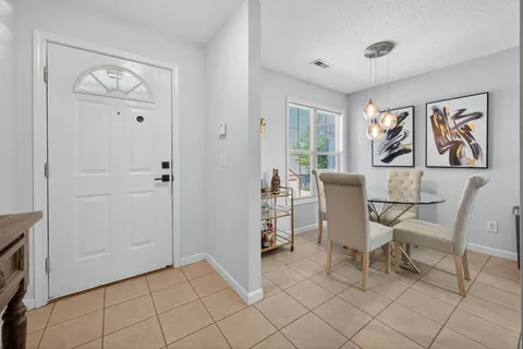 a kitchen with granite countertop a stove and a refrigerator