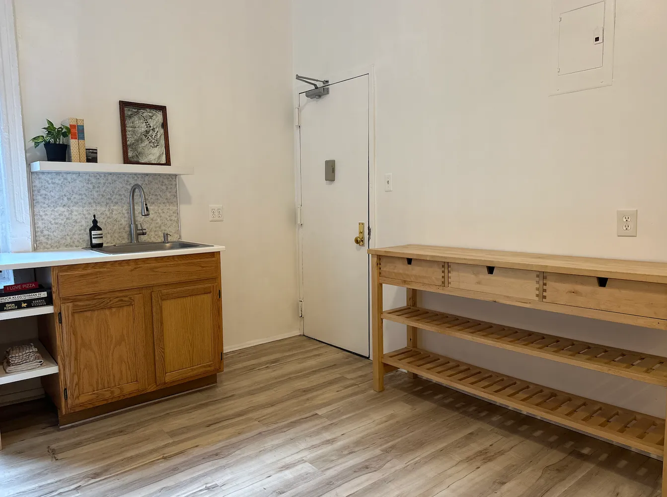 a room with a bench and cabinets