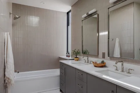 a bedroom with a large bed and a large window