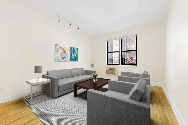 a living room with furniture and a rug