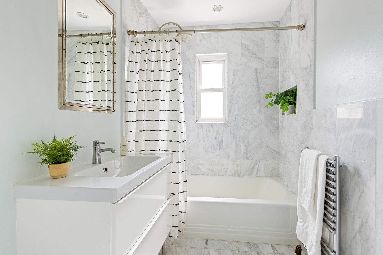 22 Sharon Street Brooklyn, NY 11211 - Photo 6 of 10 a bathroom with a bathtub and a sink