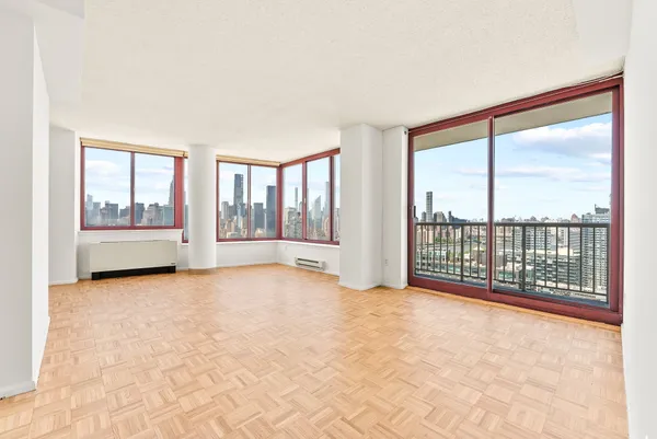 a view of an empty room with a large window