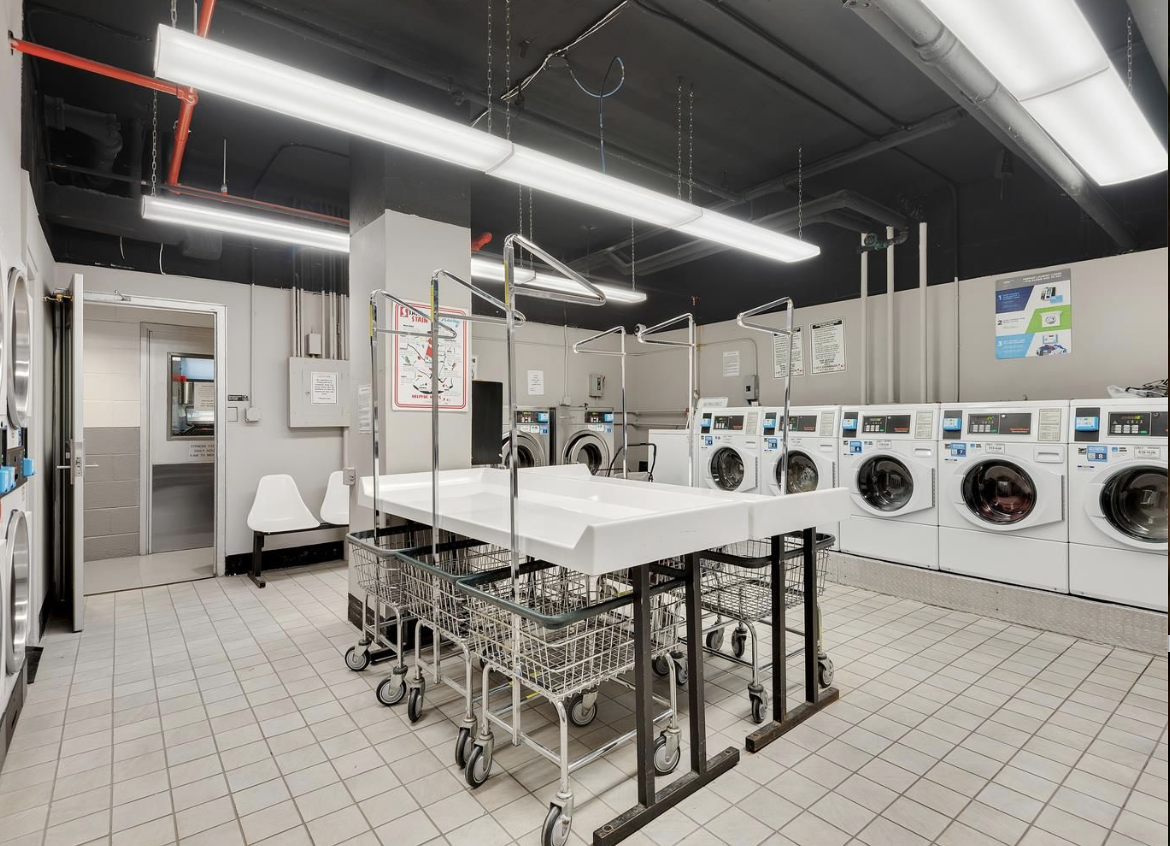 303 West 66th Street, Unit 6BW Manhattan, NY 10023 - Photo 11 of 12 a dining room with furniture and a clock