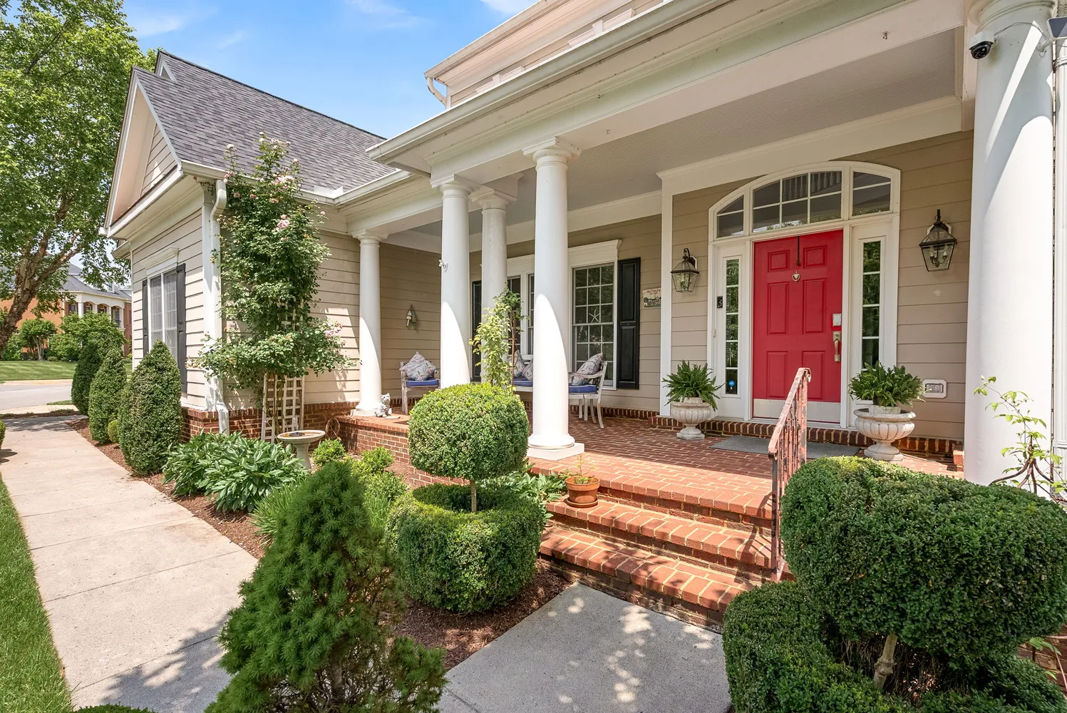 front view of a house with a yard